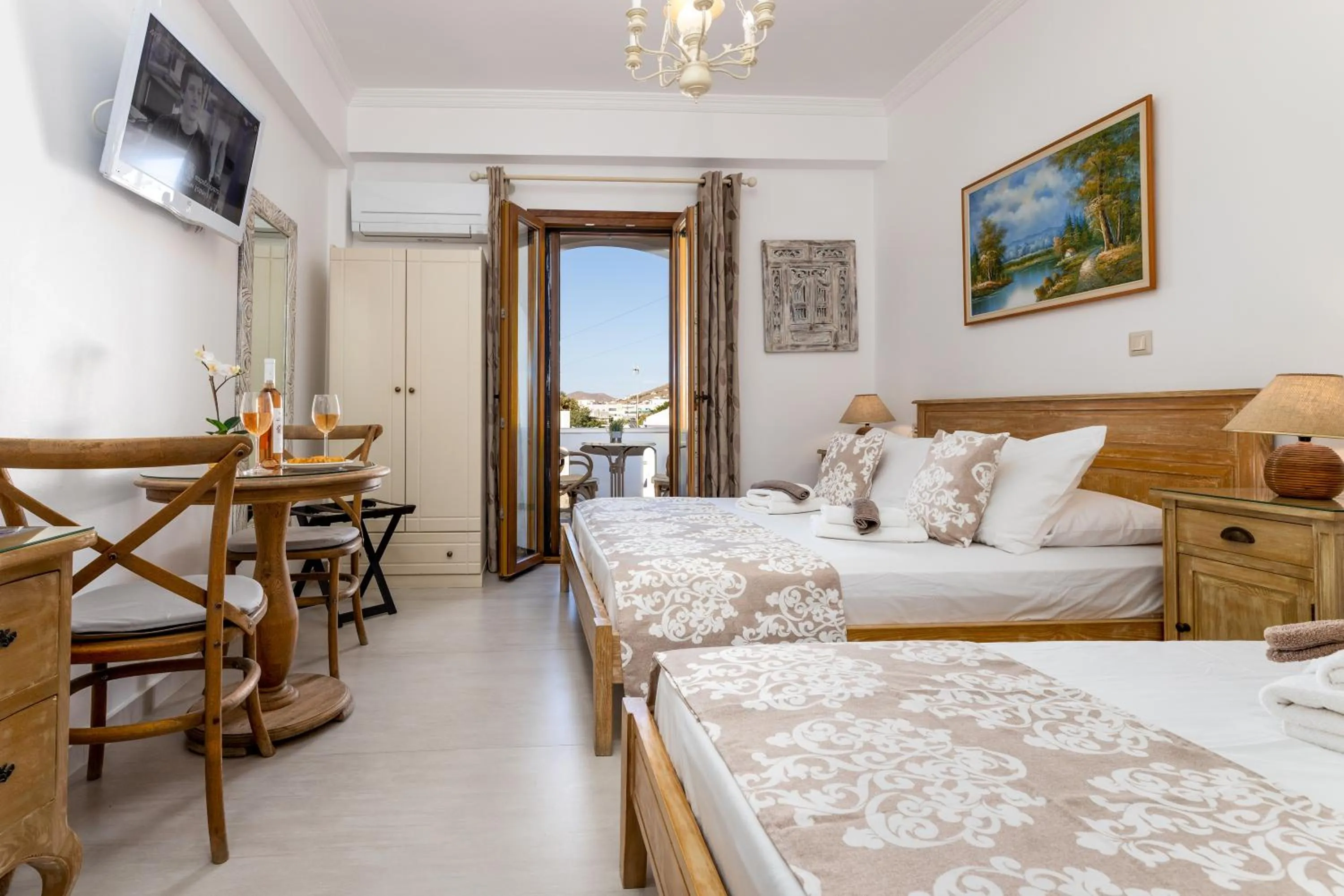 Bed in Panos Luxury Studios