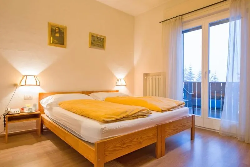 Photo of the whole room, Bed in Hotel Regina Delle Dolomiti