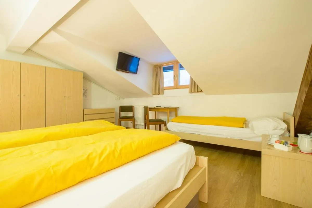 Photo of the whole room, Bed in Hotel Regina Delle Dolomiti