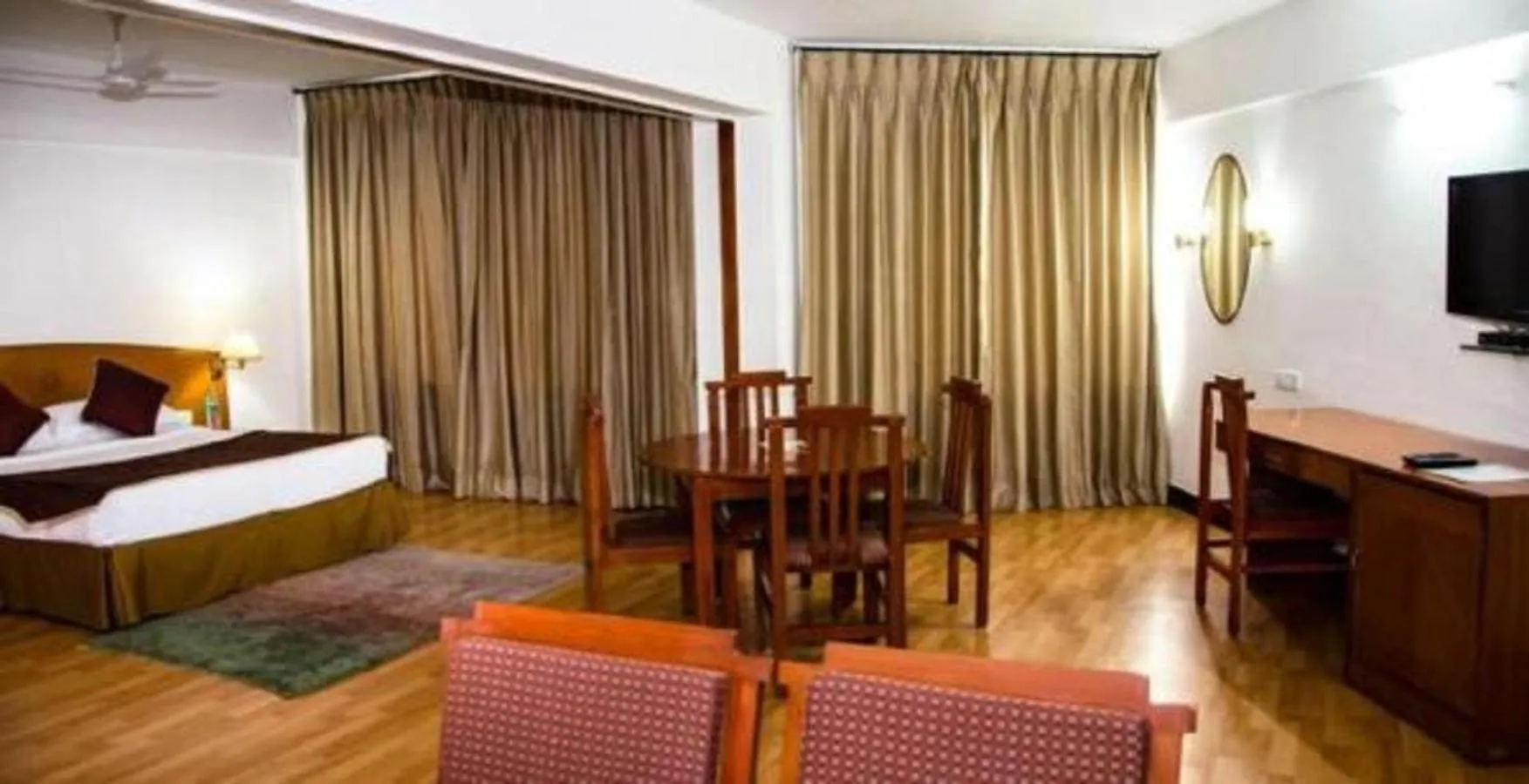 Living room, Bed in Ramee Guestline Tirupati