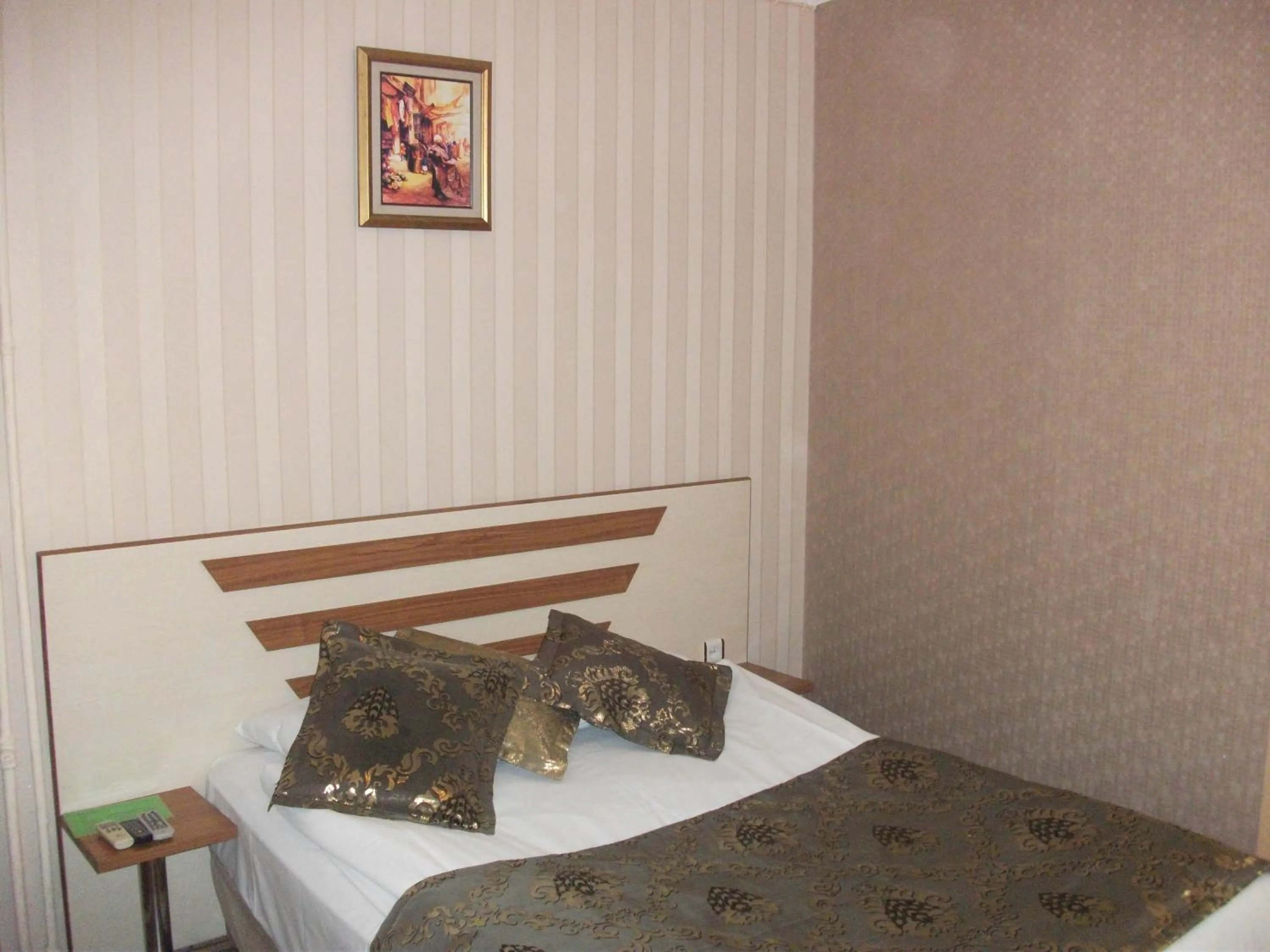 Bed in Tac Hotel