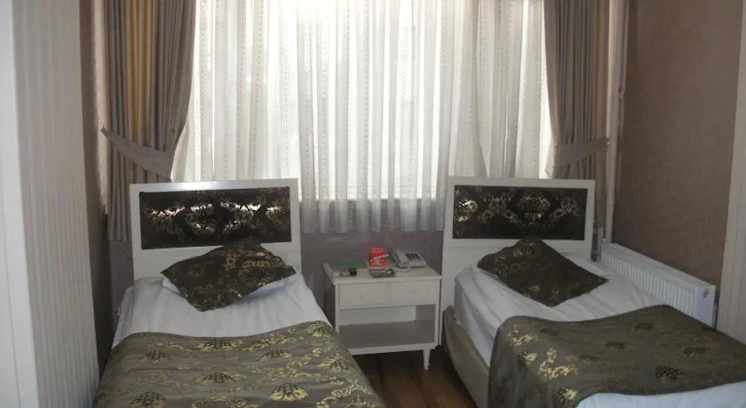 Bed in Tac Hotel