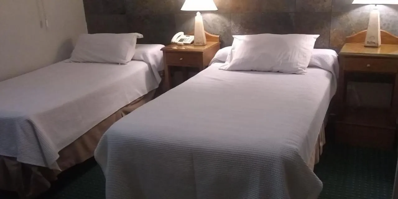 Bed in Apart Hotel Maue