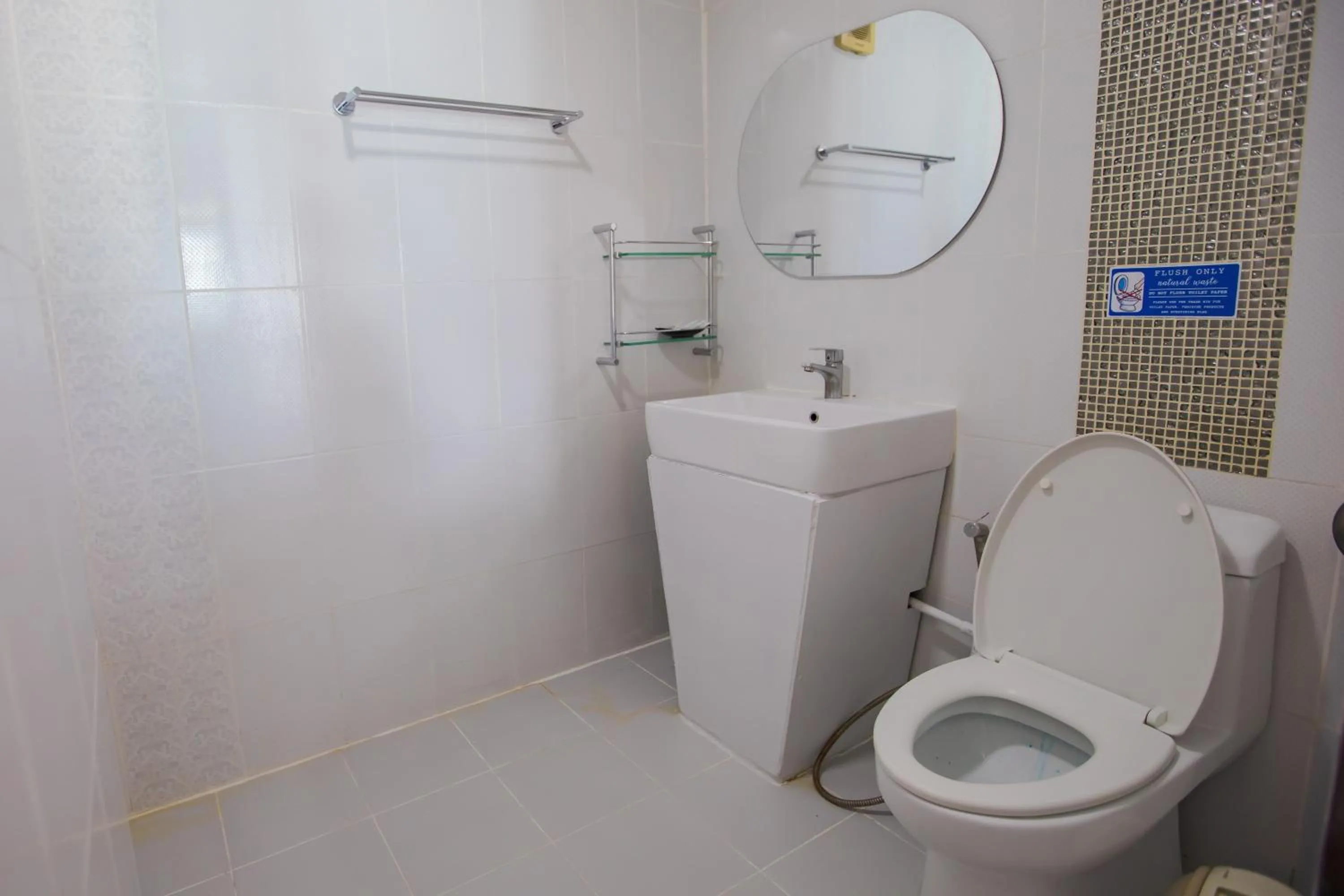 Toilet in Chareena Hill Beach Resort