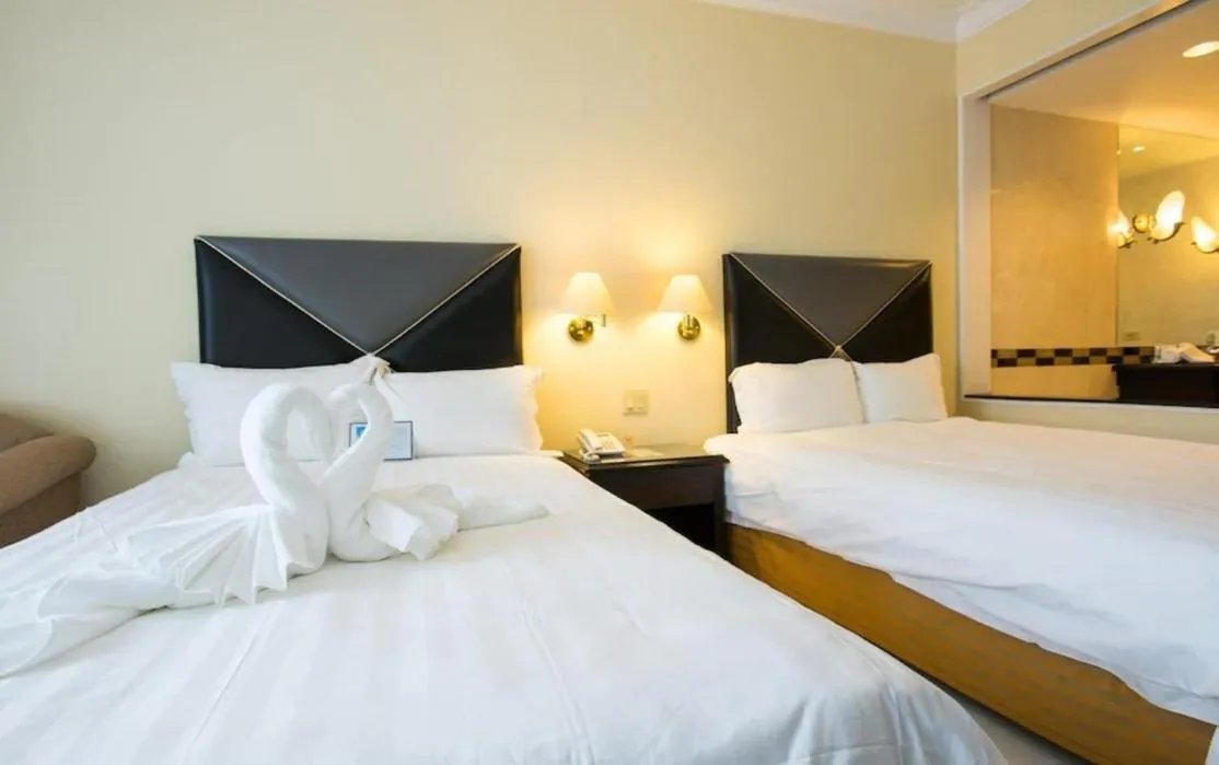 Bed in Royal Orchid Hotel Guam