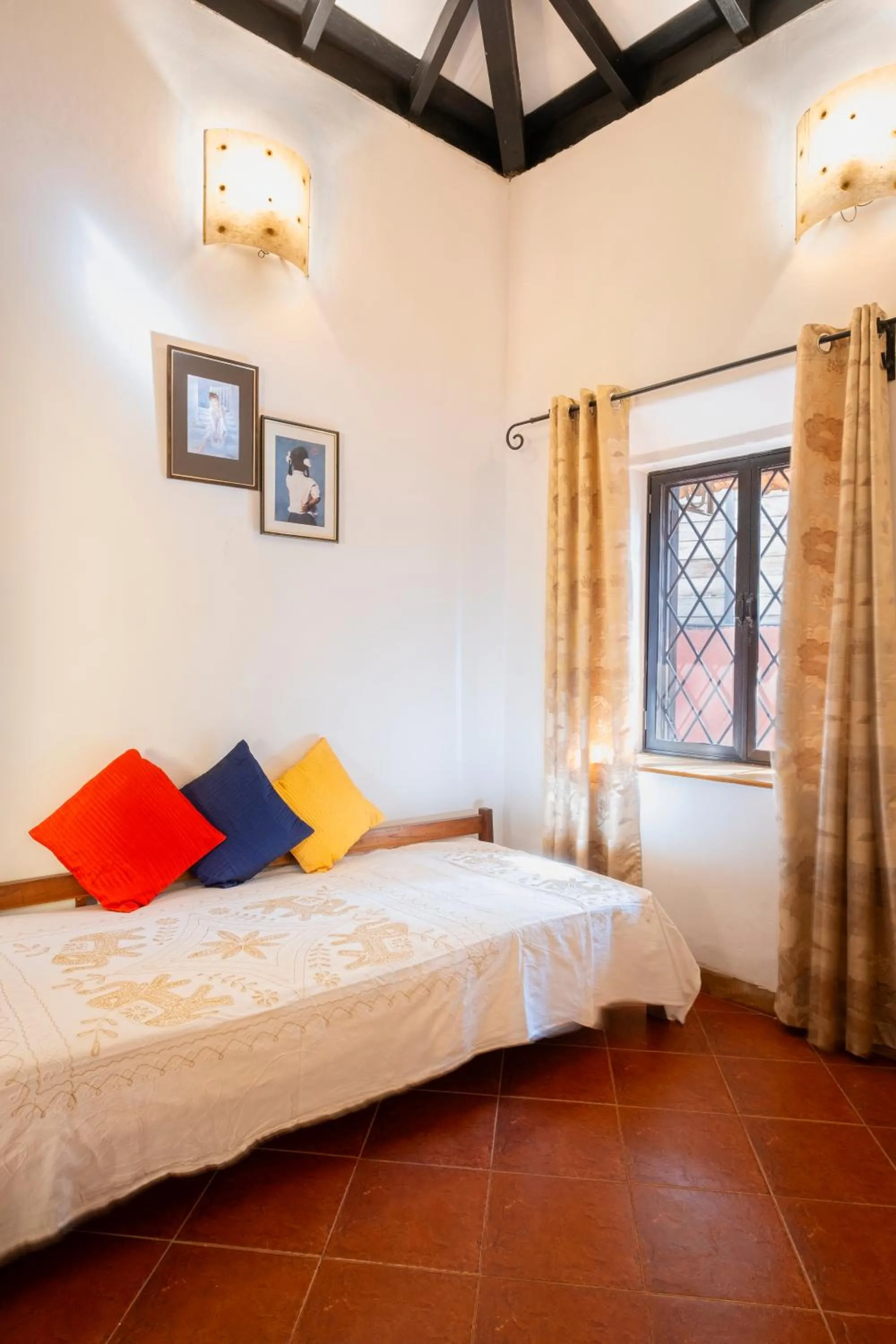 Bed in Granpa's Inn Hotel Bougainvillea