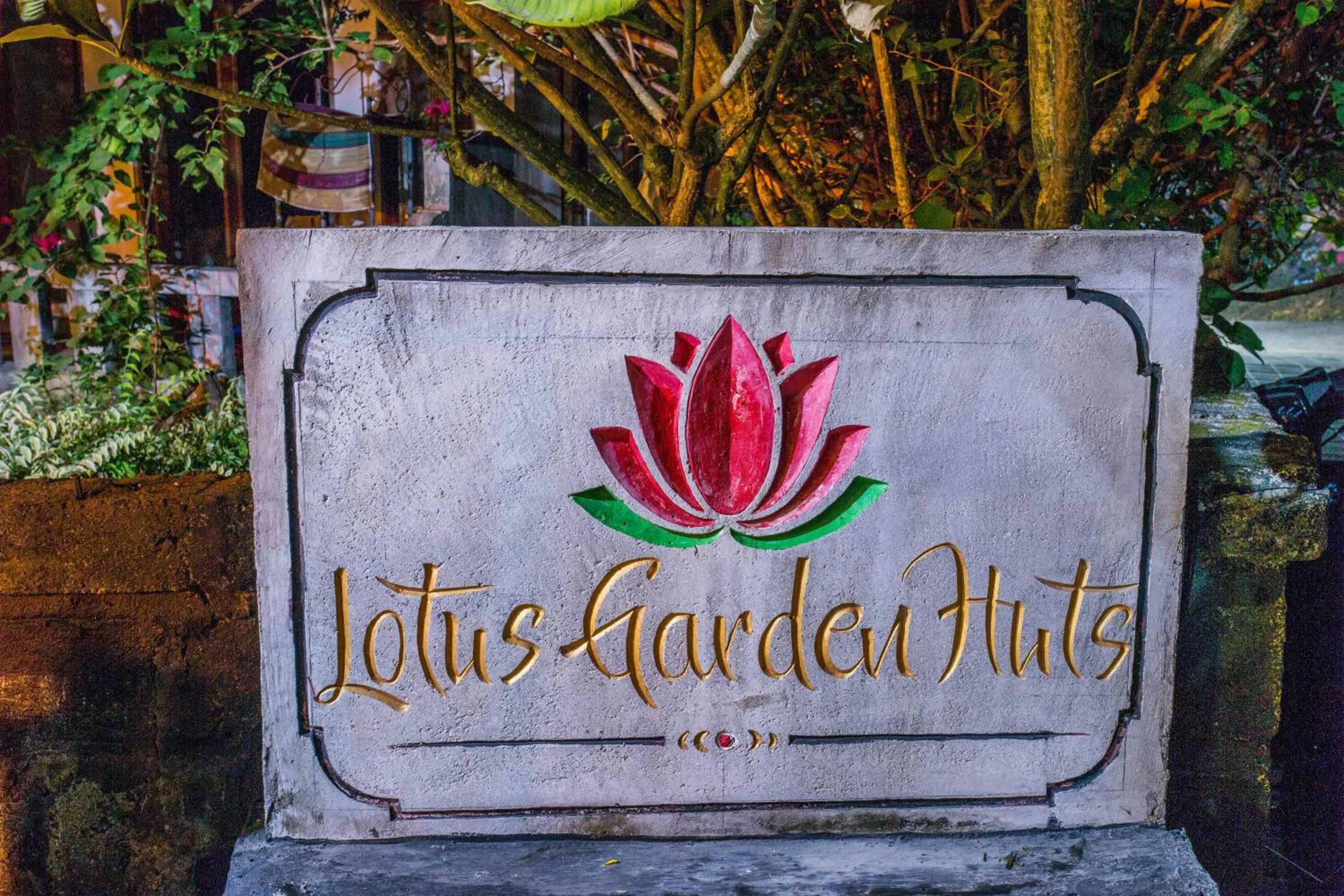 Property logo or sign in Lotus Garden Huts