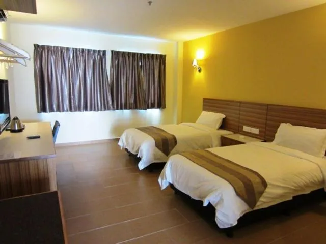 Bed in Grand Court Hotel