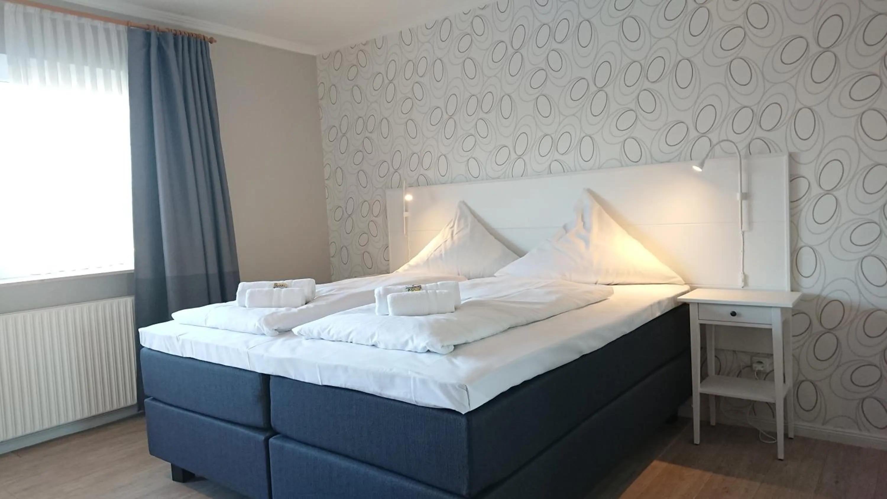 Bed in Ostseehotel Kappeln by team SchleiFee