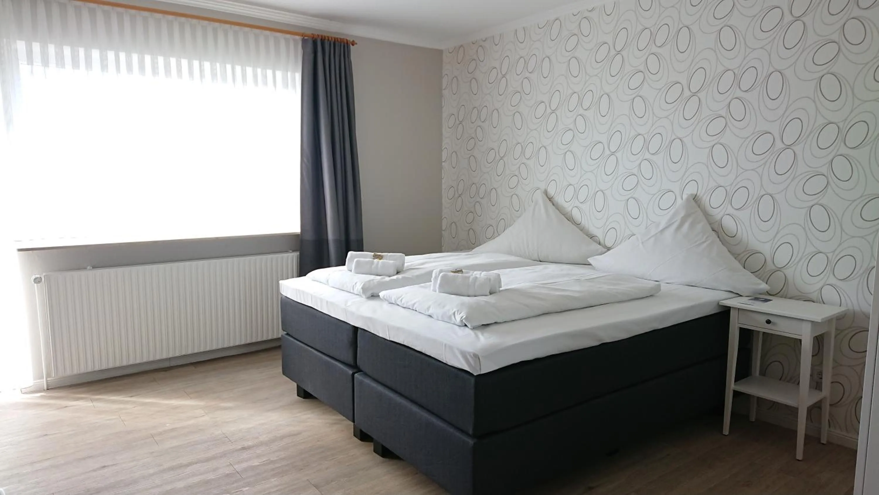 Bed in Ostseehotel Kappeln by team SchleiFee