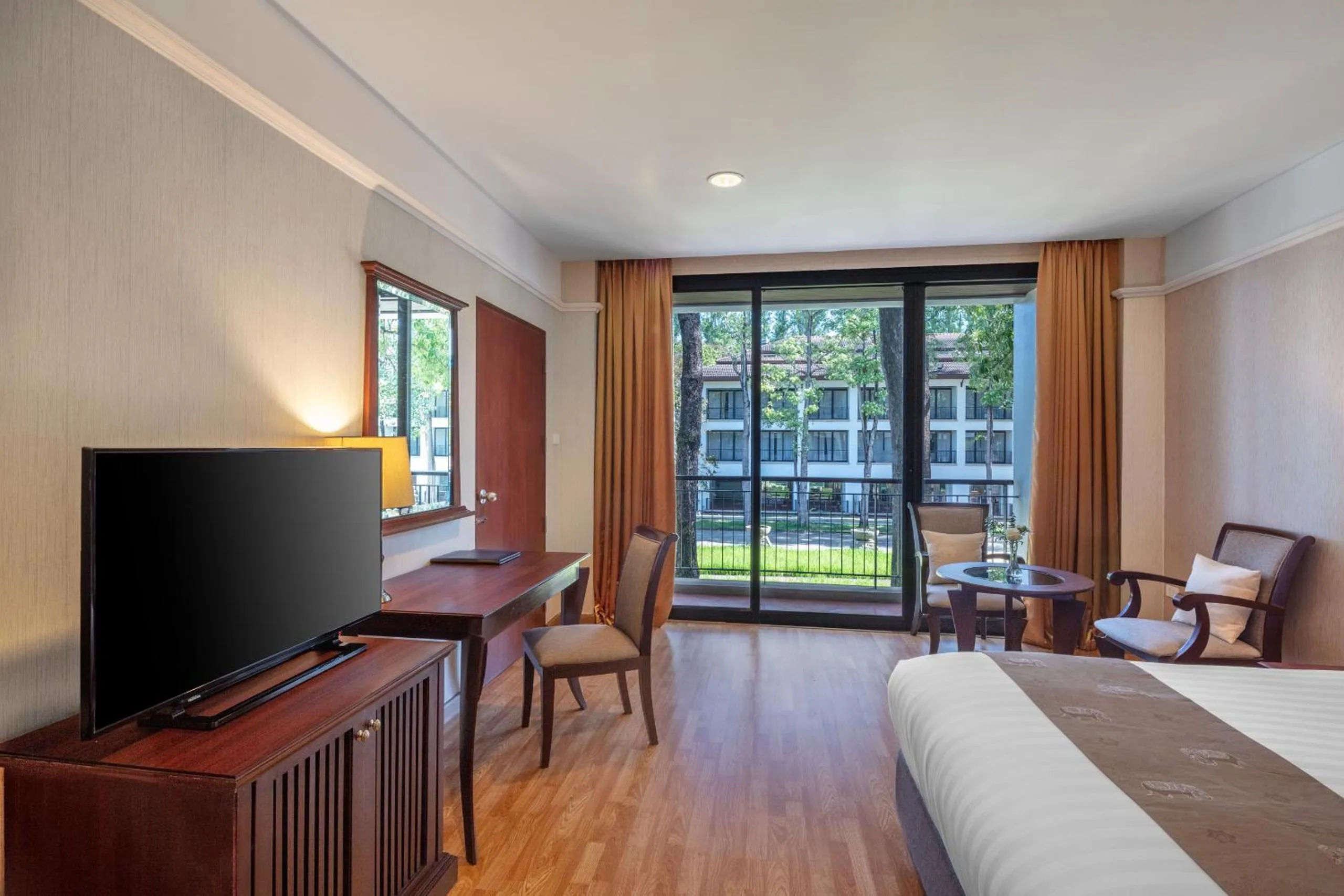 Bed in Tawa Ravadee Resort Prachinburi, a member of WorldHotels Distinctive