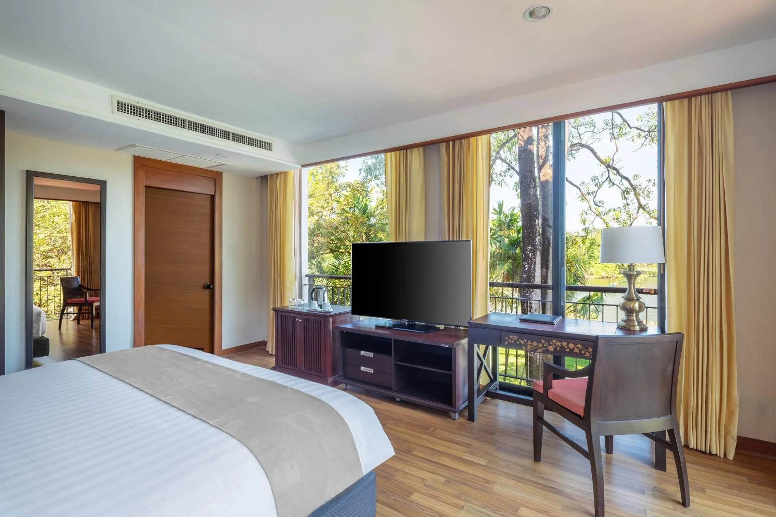 Bed in Tawa Ravadee Resort Prachinburi, a member of WorldHotels Distinctive