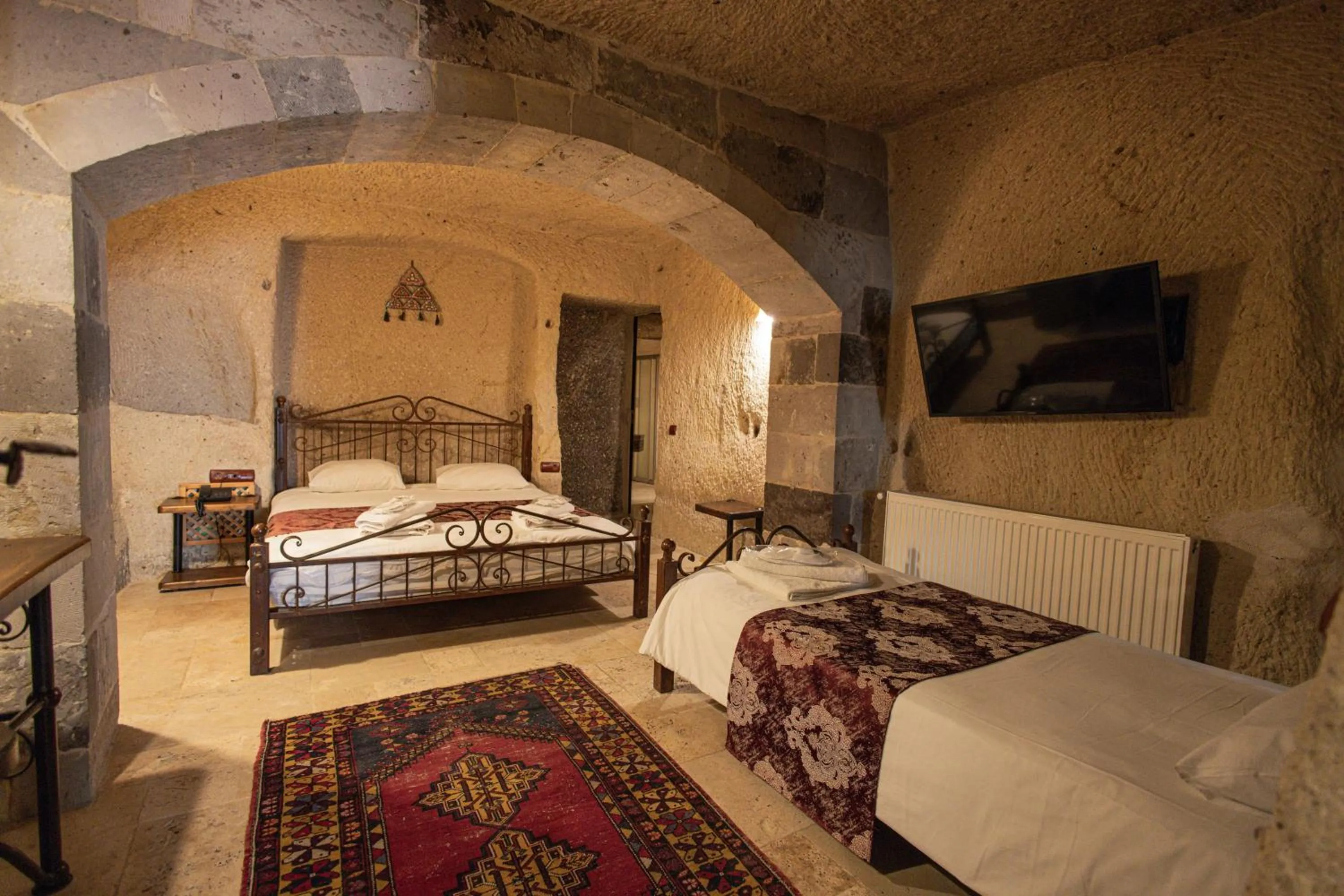Bed in Century Cave Hotel