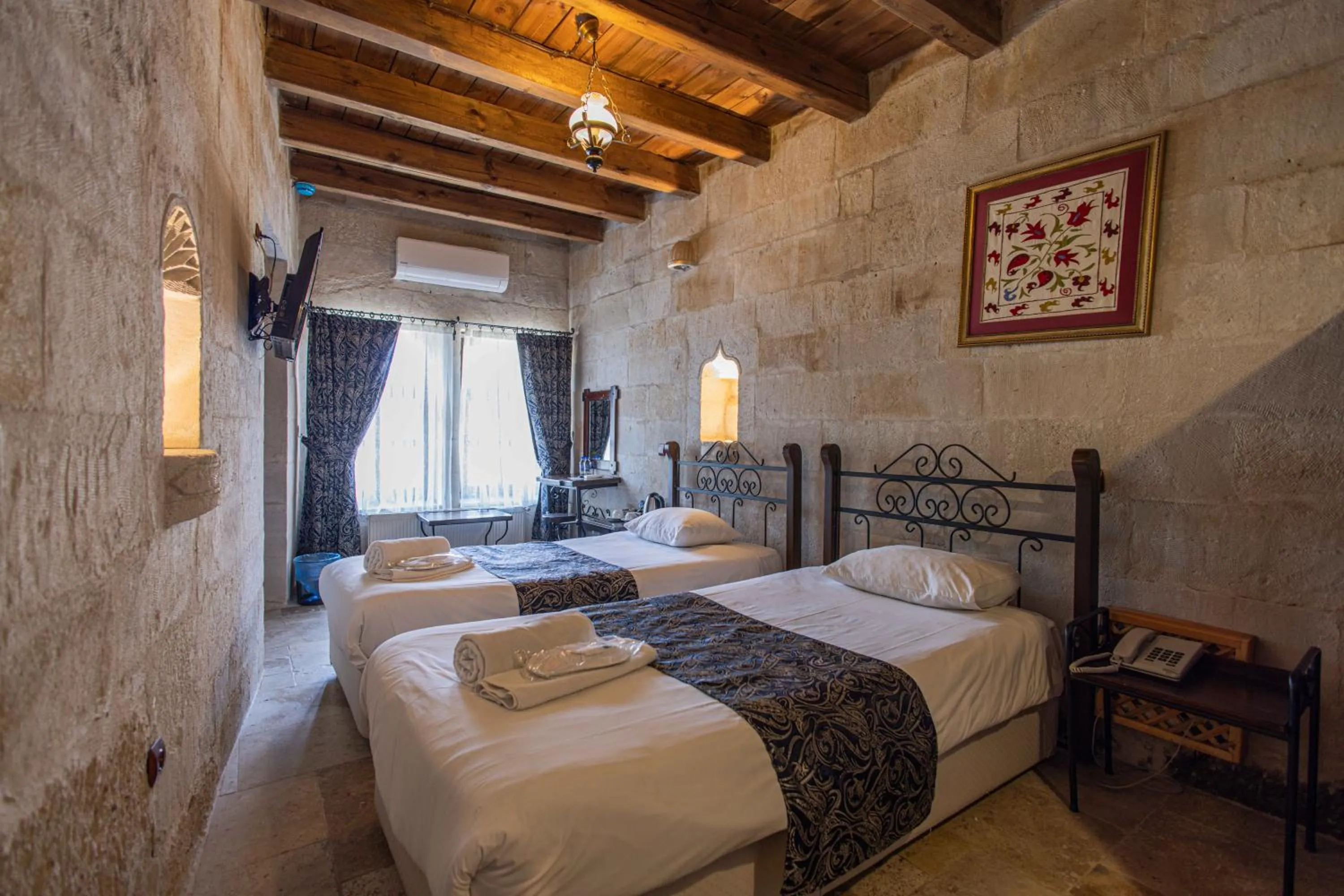 Bed in Century Cave Hotel