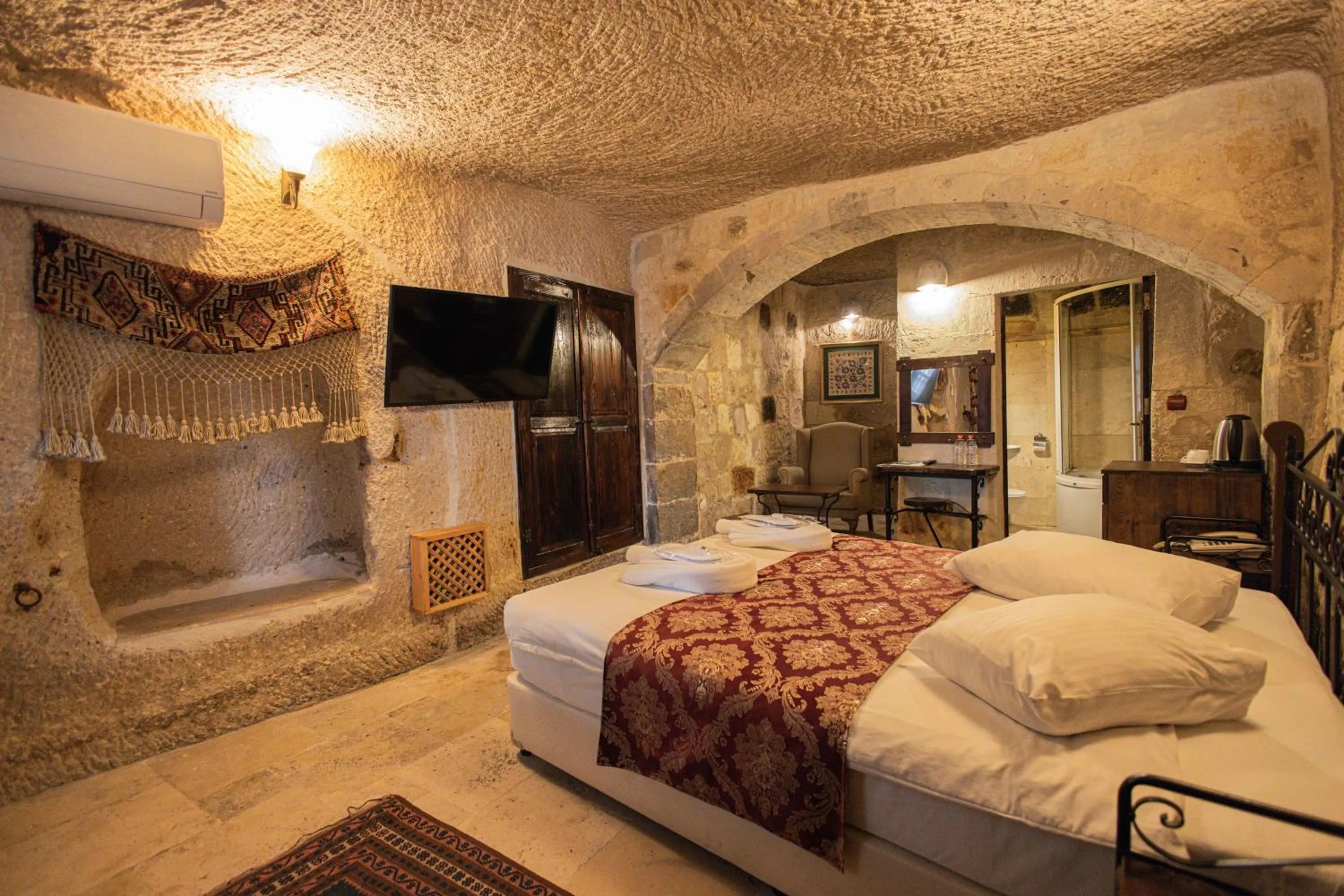 Bed in Century Cave Hotel