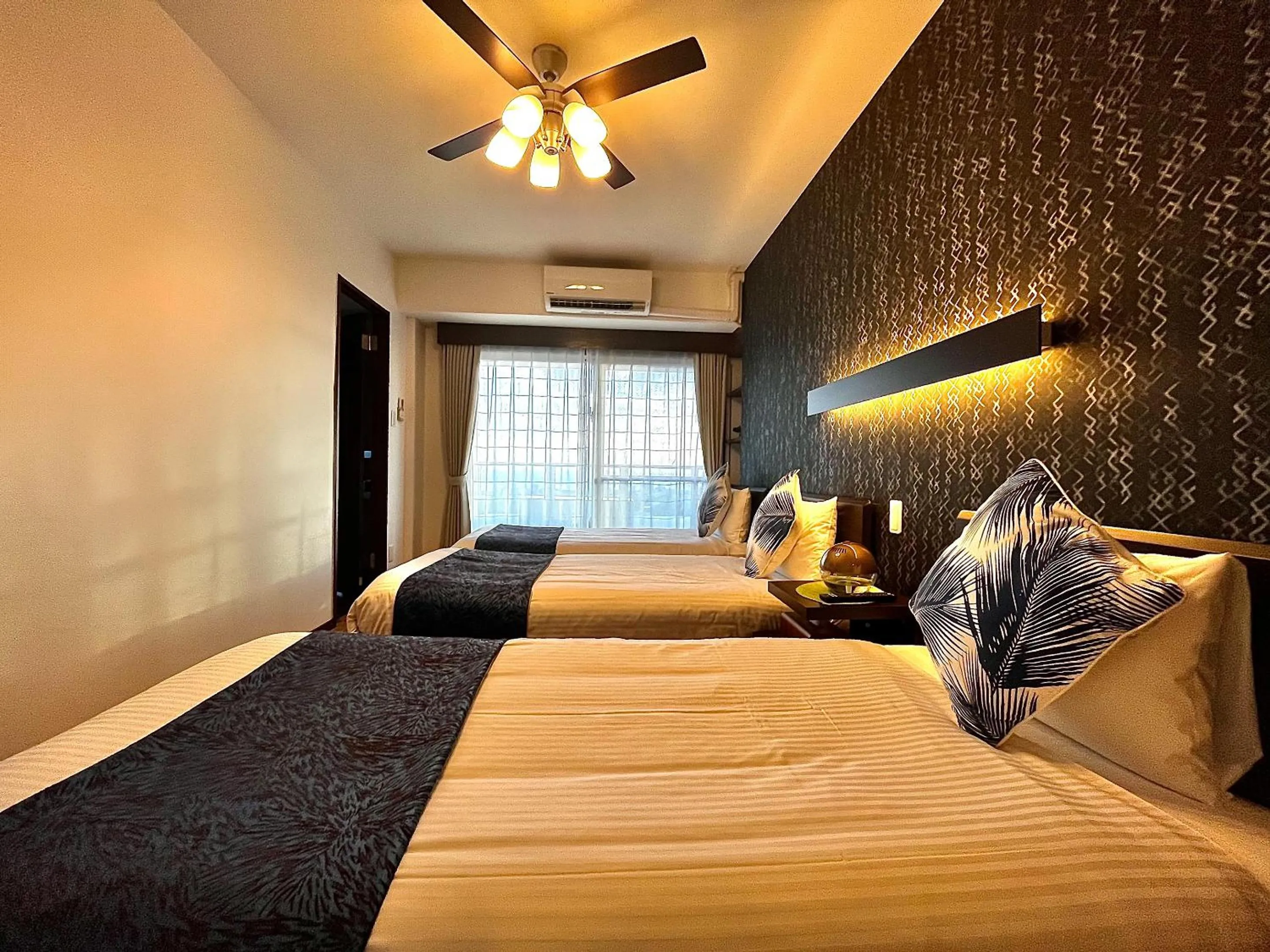 Bedroom, Bed in Zoe Resort The Sunset Village Okinawa Chatan