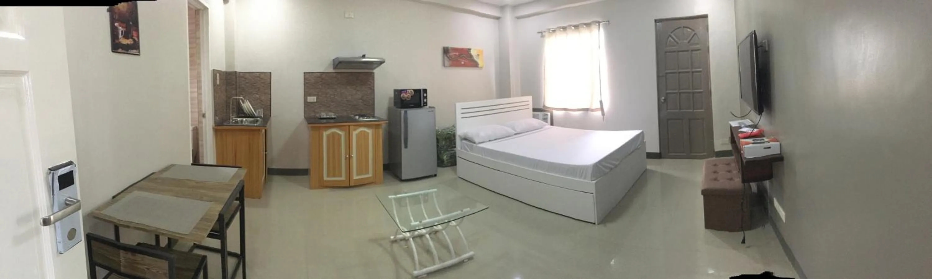 Kitchen or kitchenette, Bed in Beinte Singko de Marso Apartments