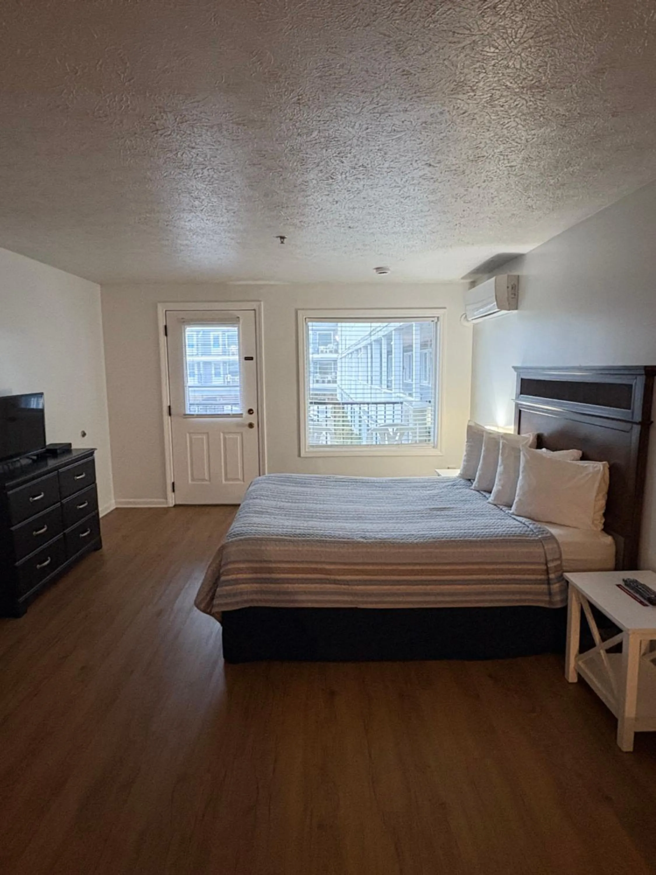 Bed in The Grand Beach Inn