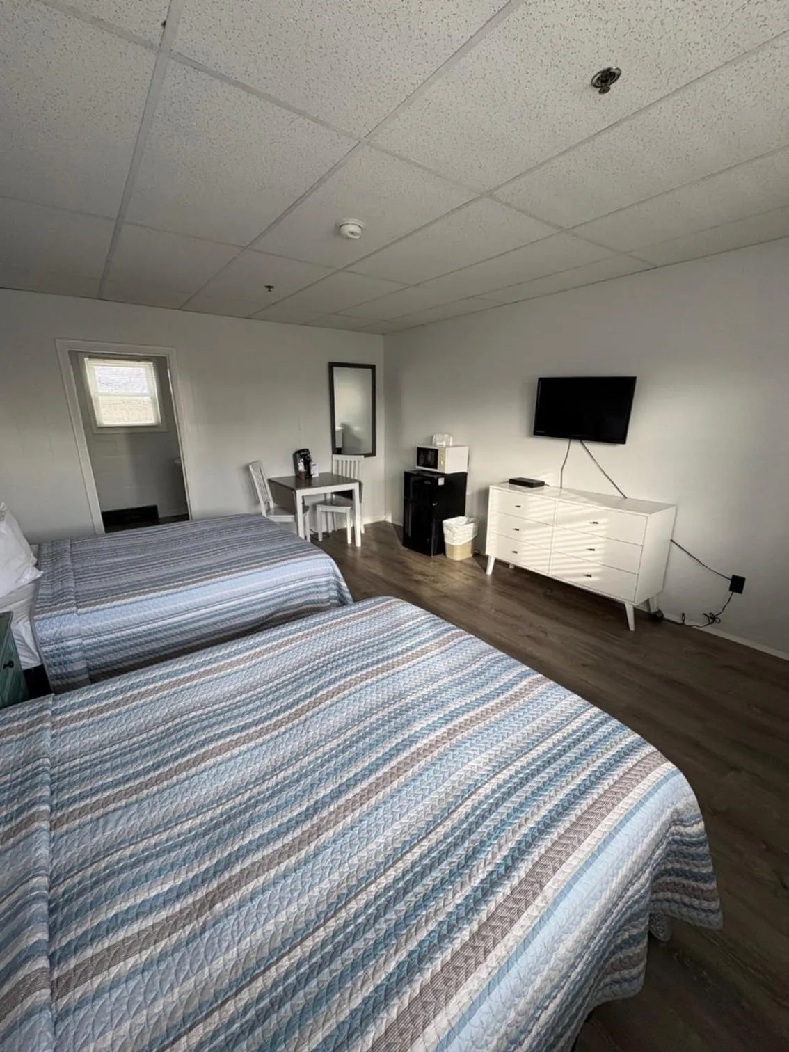 Bed in The Grand Beach Inn