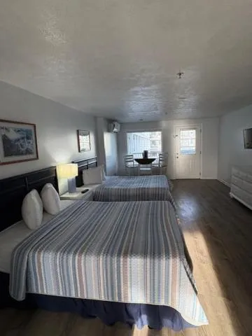 Bed in The Grand Beach Inn