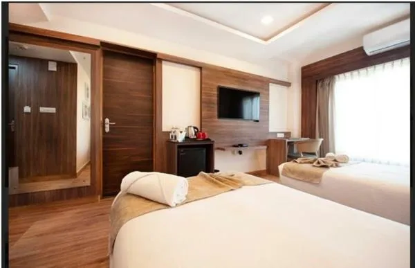 Bed in Purple Cloud Hotel