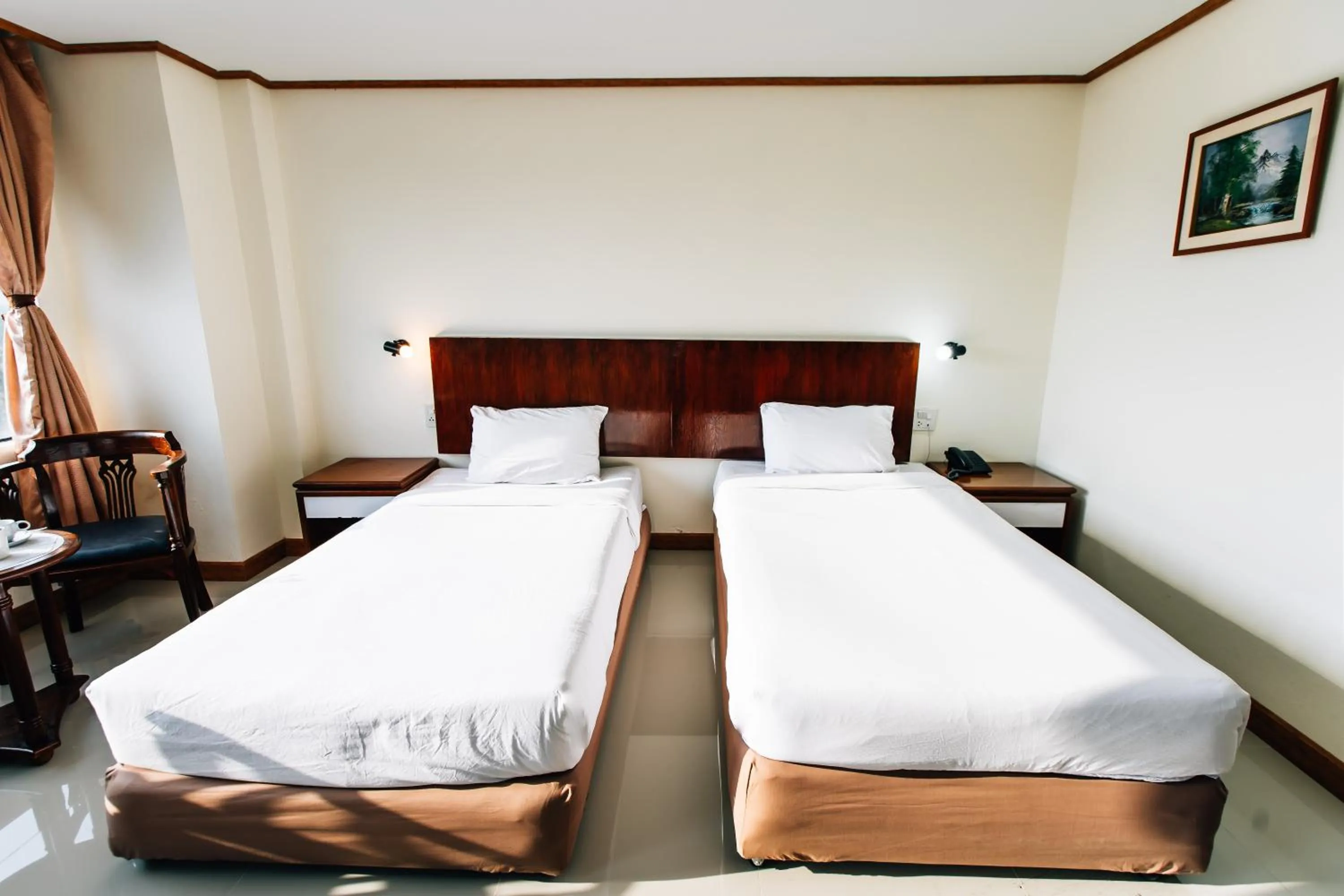 Bed in Sinkiat Thani Hotel