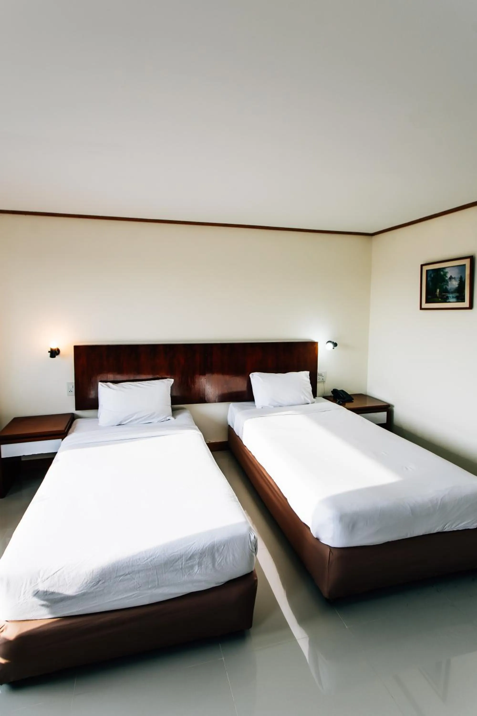 Bed in Sinkiat Thani Hotel