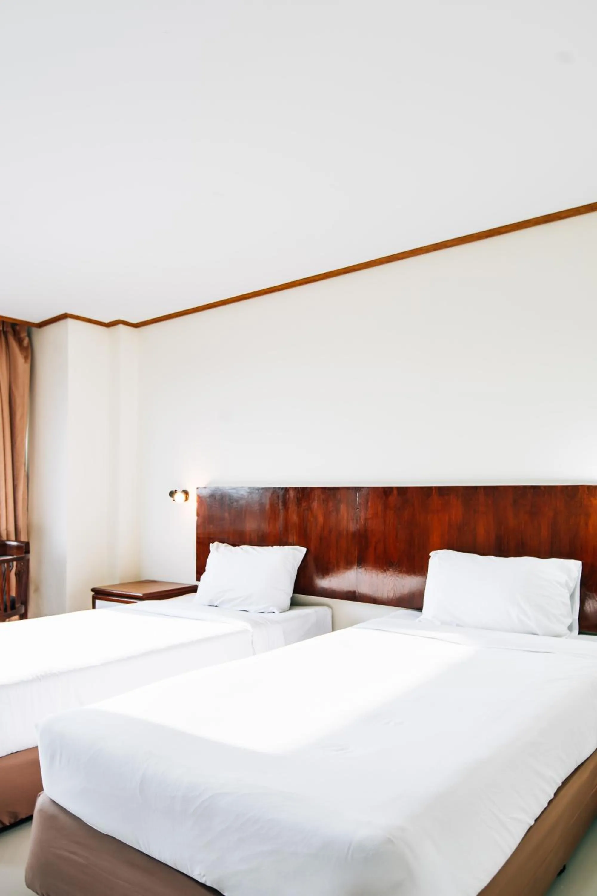 Bed in Sinkiat Thani Hotel