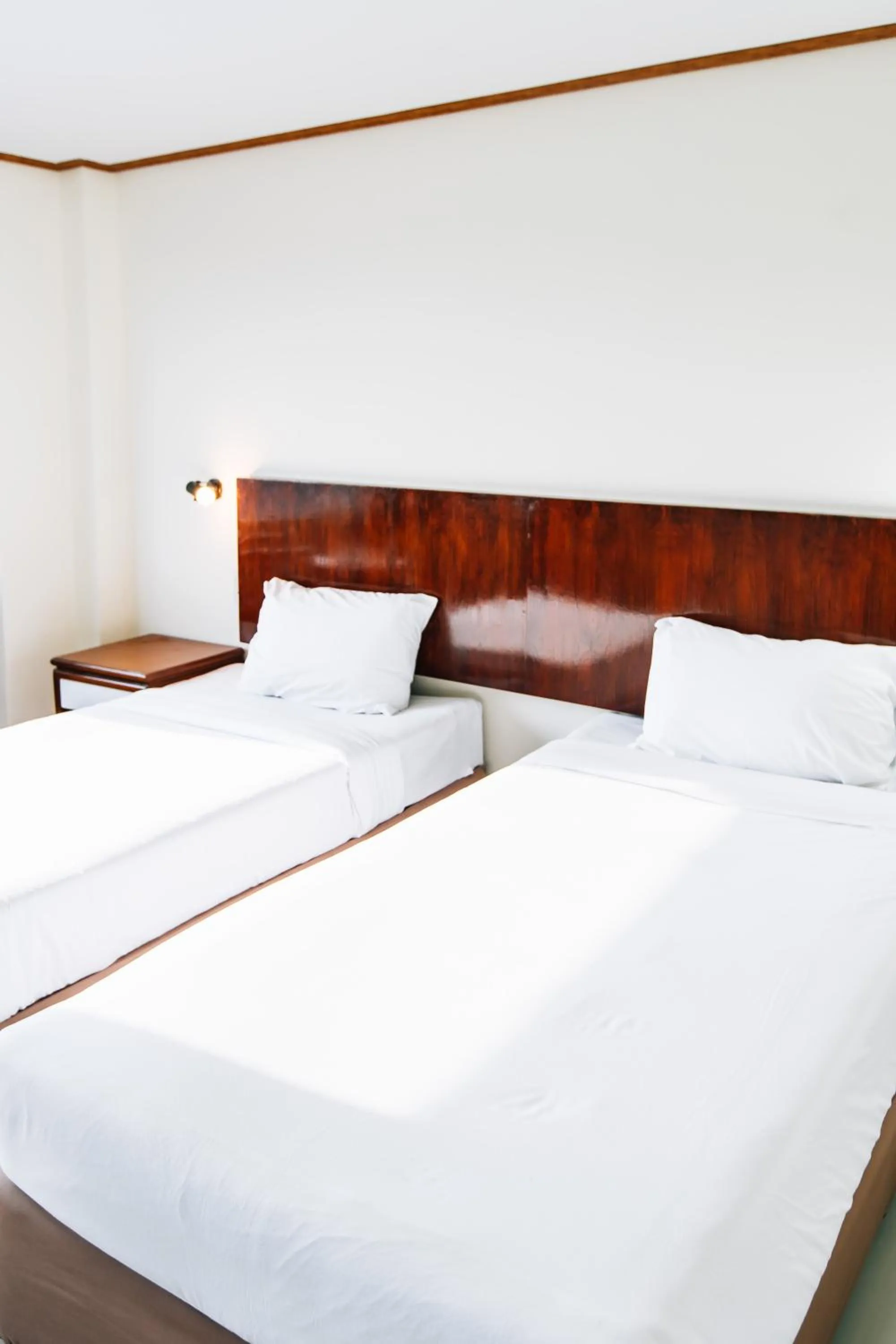 Bed in Sinkiat Thani Hotel