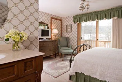 Bed in Inn at Ellis River