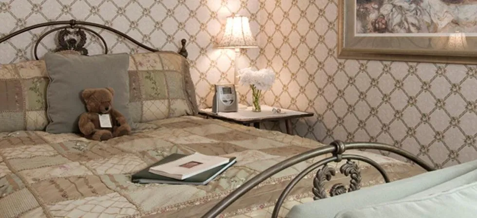 Bed in Inn at Ellis River