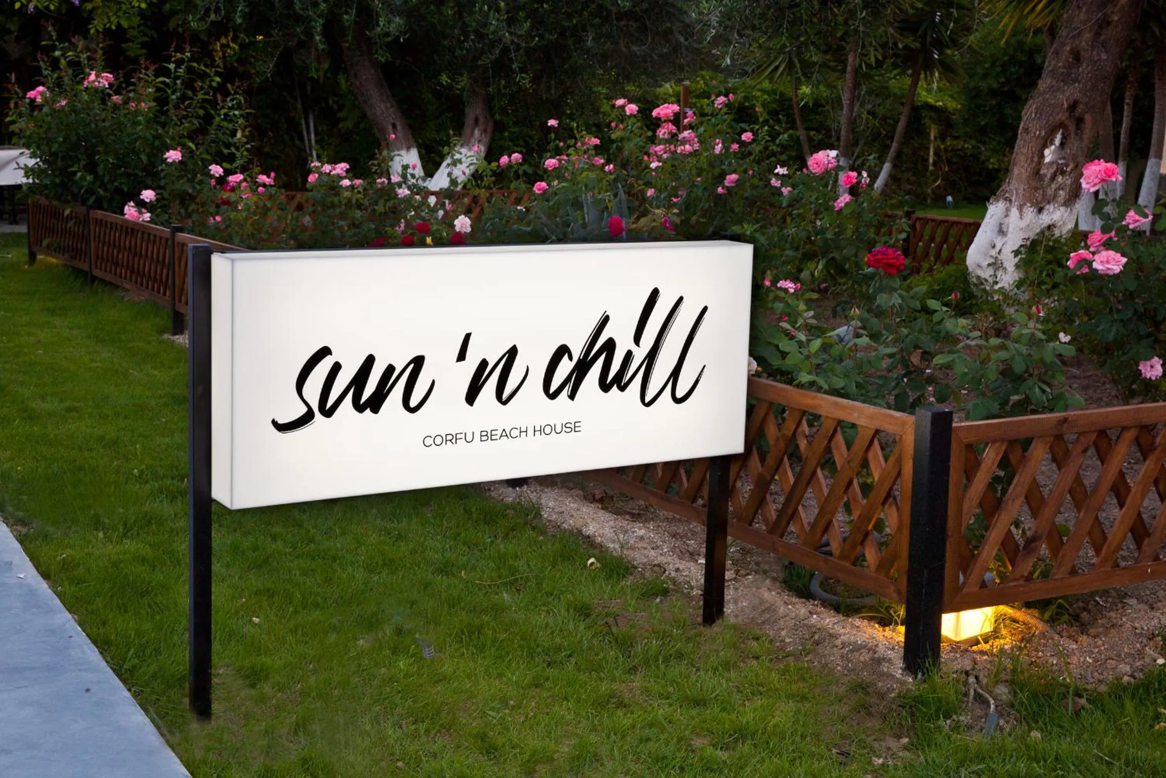Property logo or sign in Sun 'n Chill, Boutique Apartments & Beach Villa