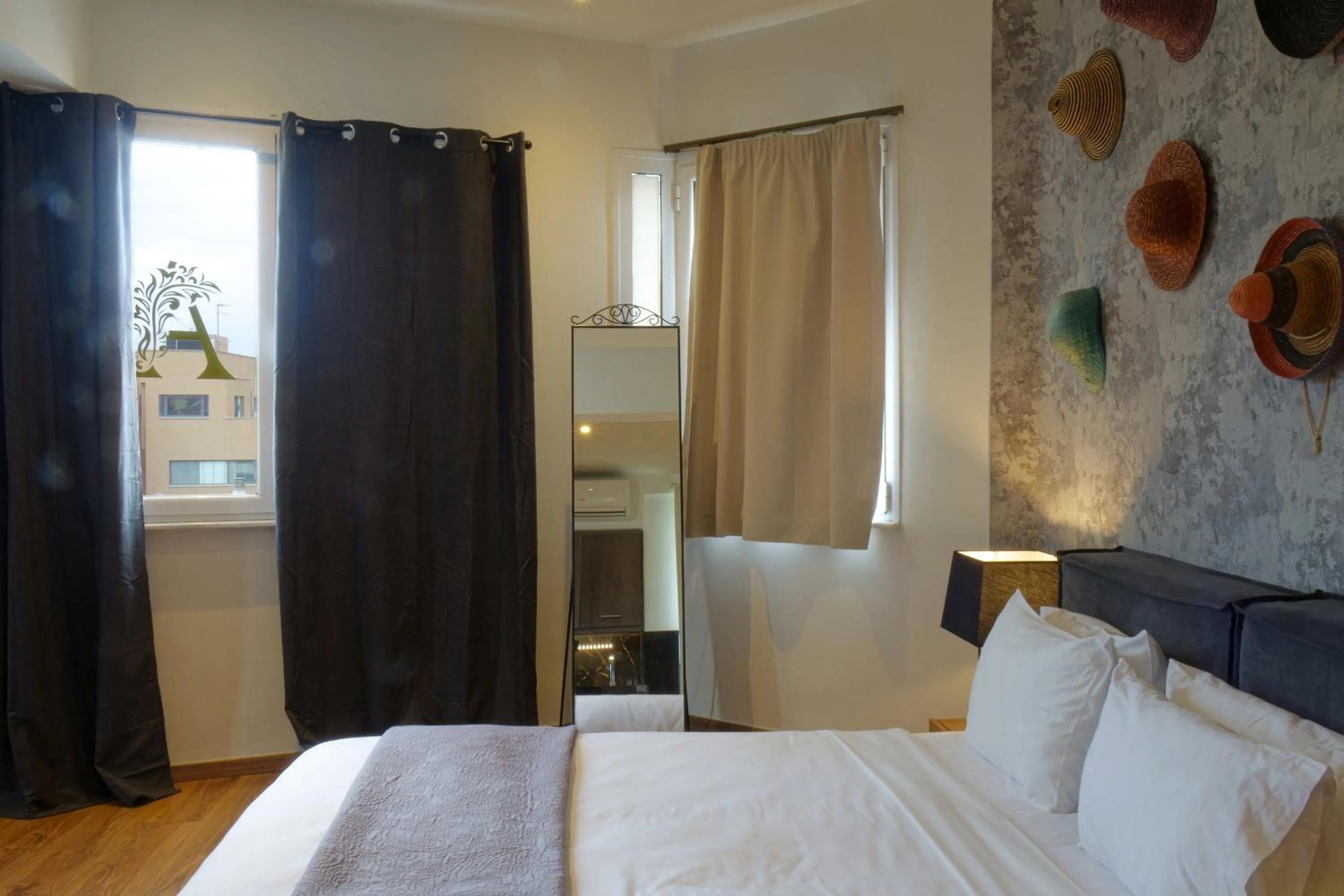 Bed in The Athens Version Luxury Suites