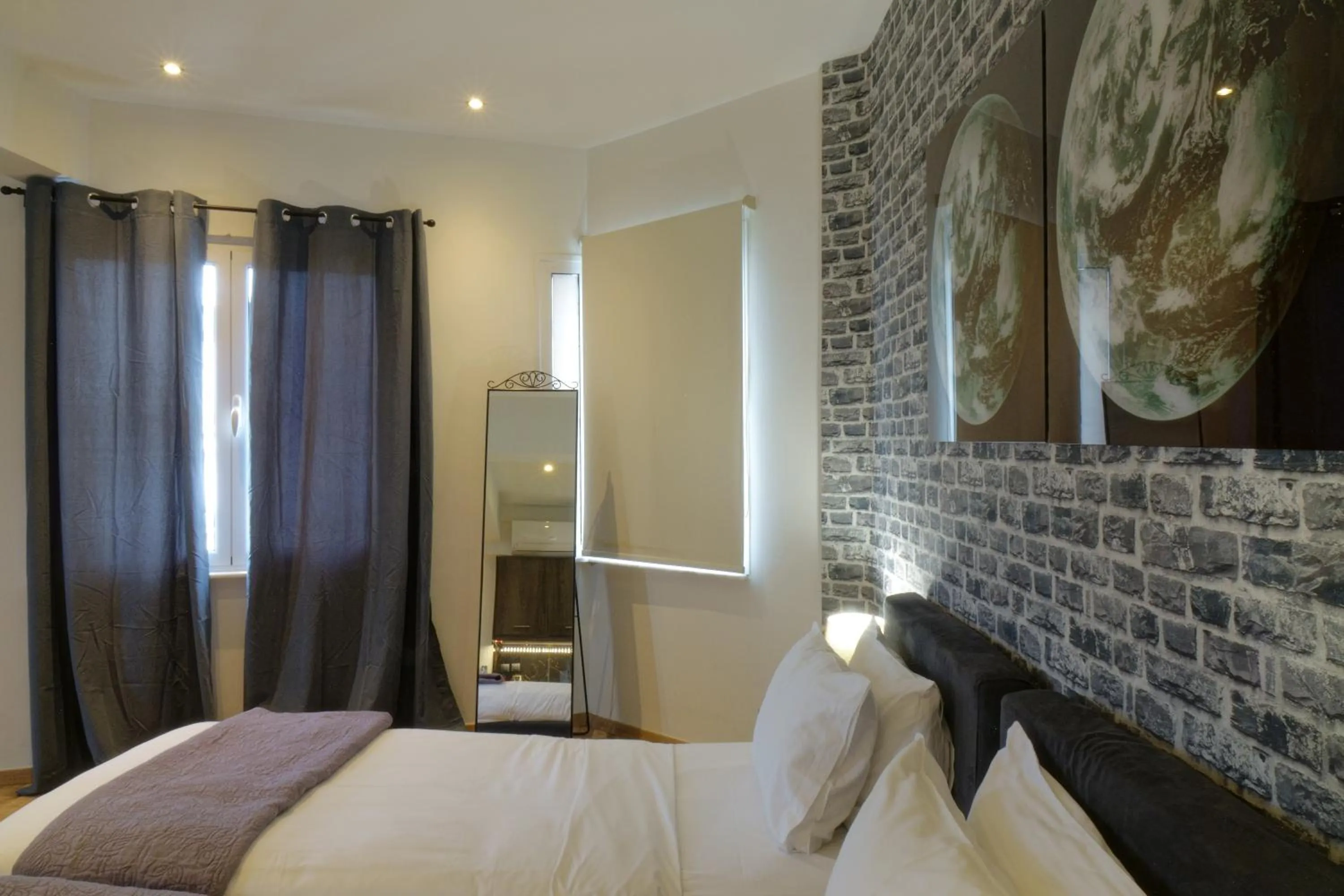 Bed in The Athens Version Luxury Suites