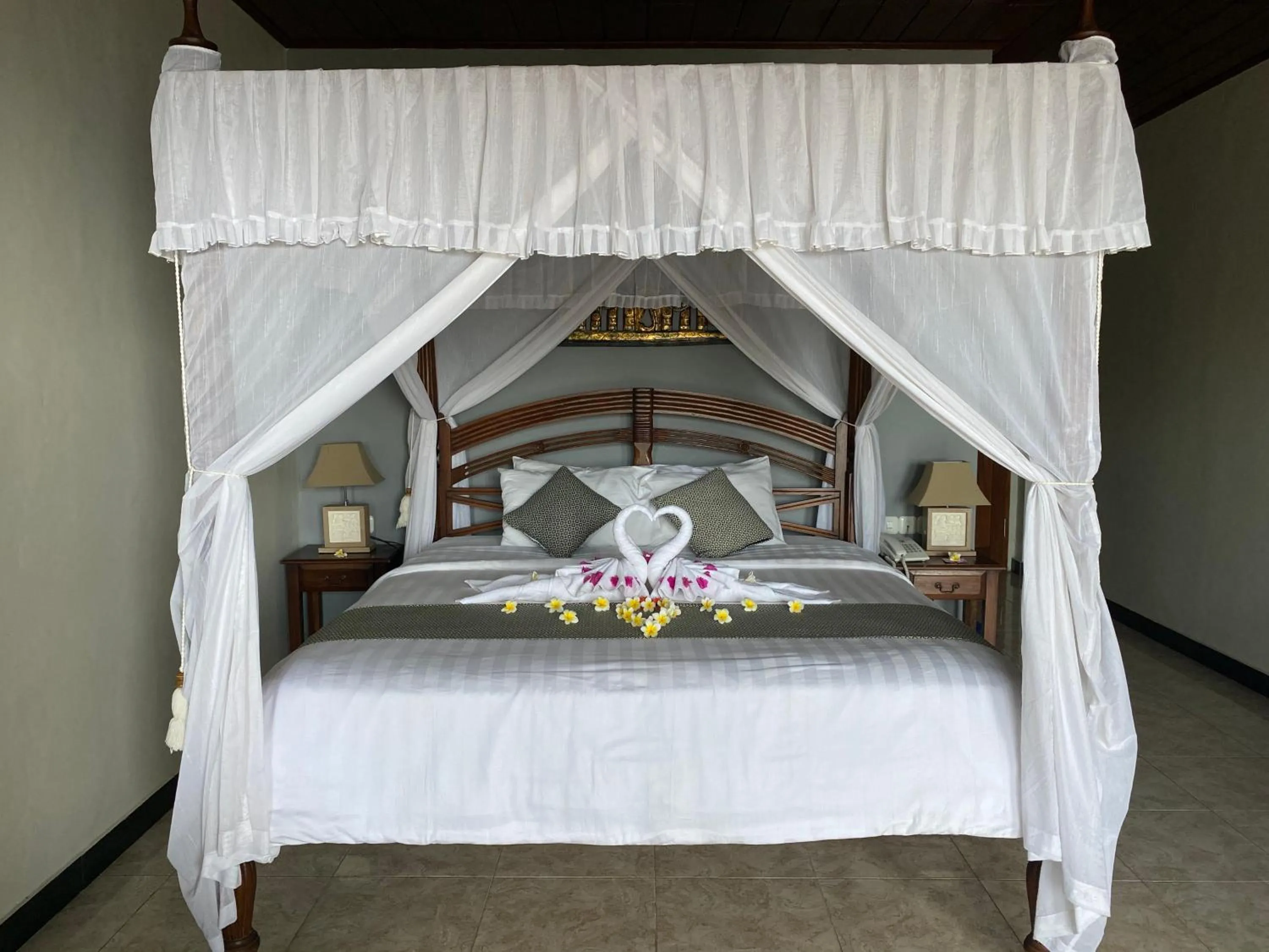 Bed in Puri Wirata Dive Resort and Spa Amed