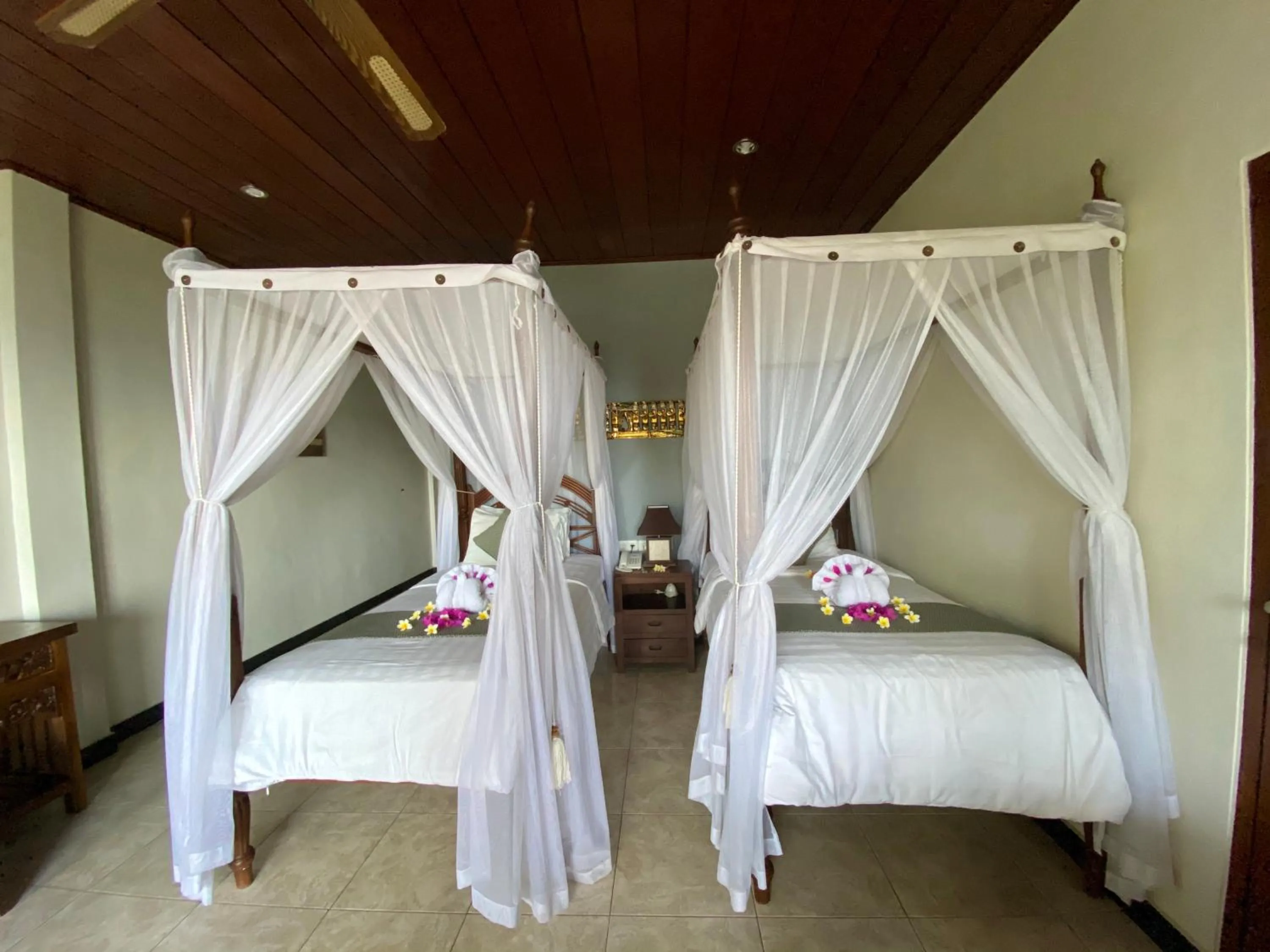 Bed in Puri Wirata Dive Resort and Spa Amed