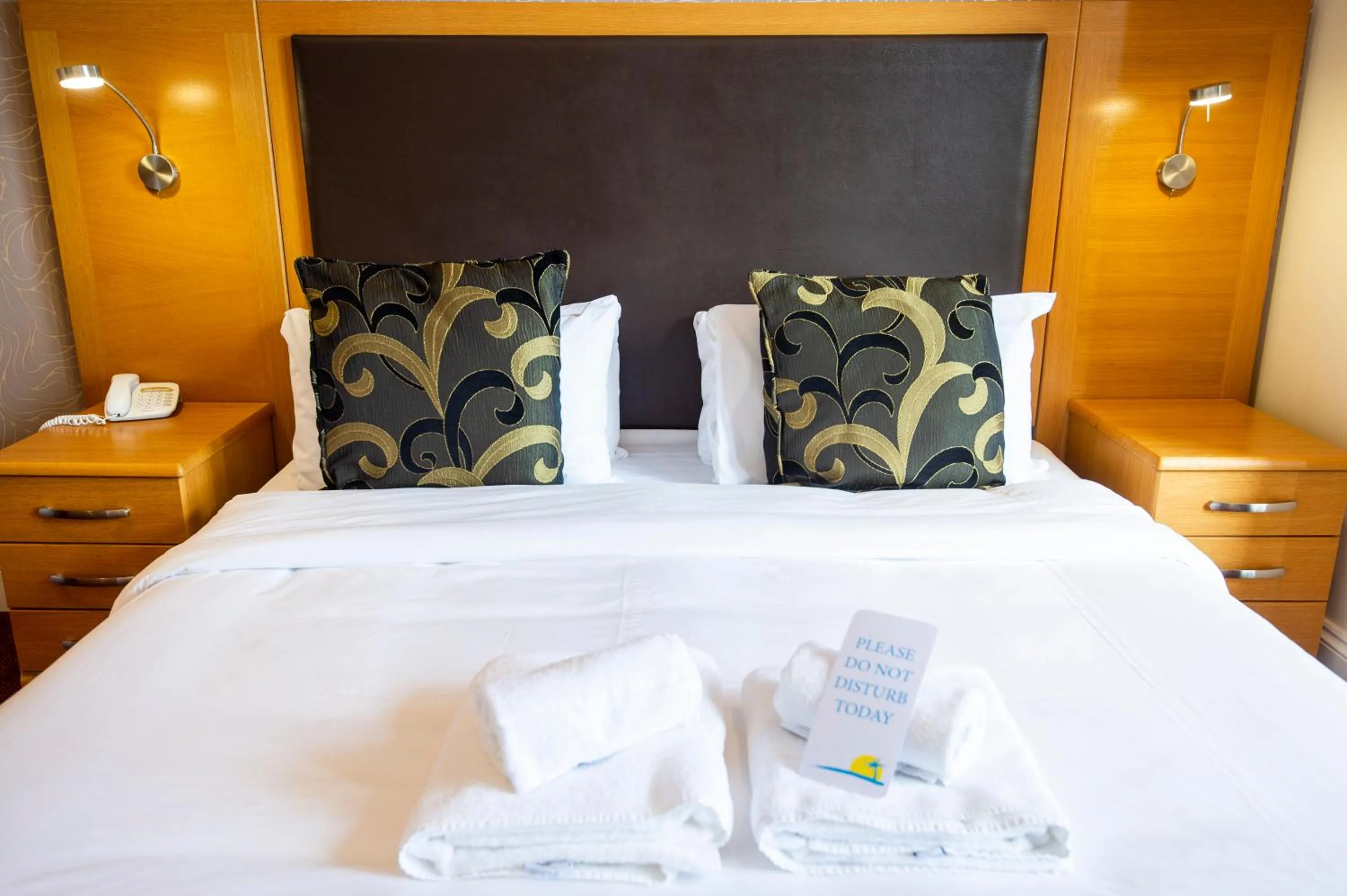 Bed in Palm Court Hotel