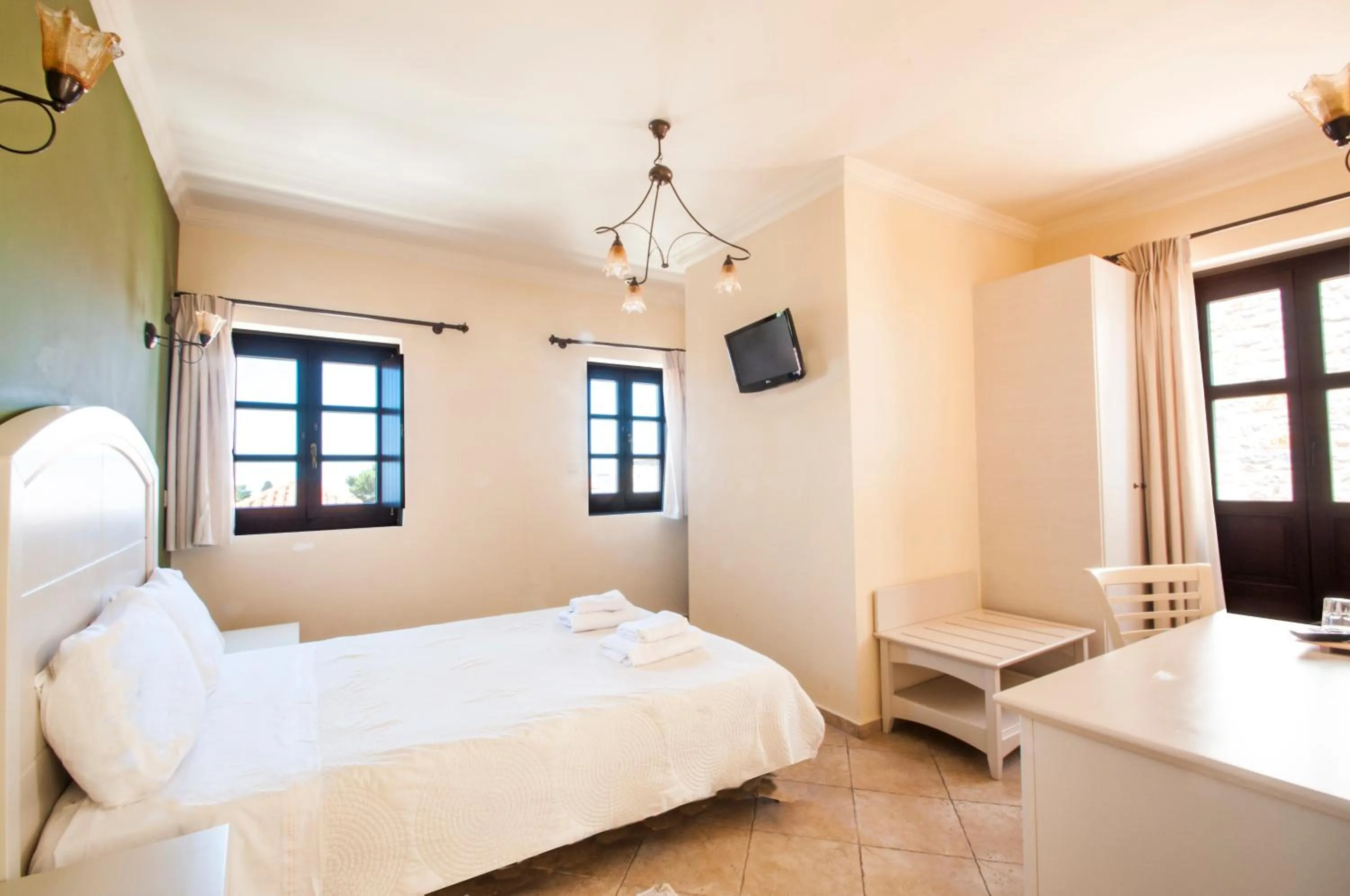 Bed in Areos Polis Boutique Hotel