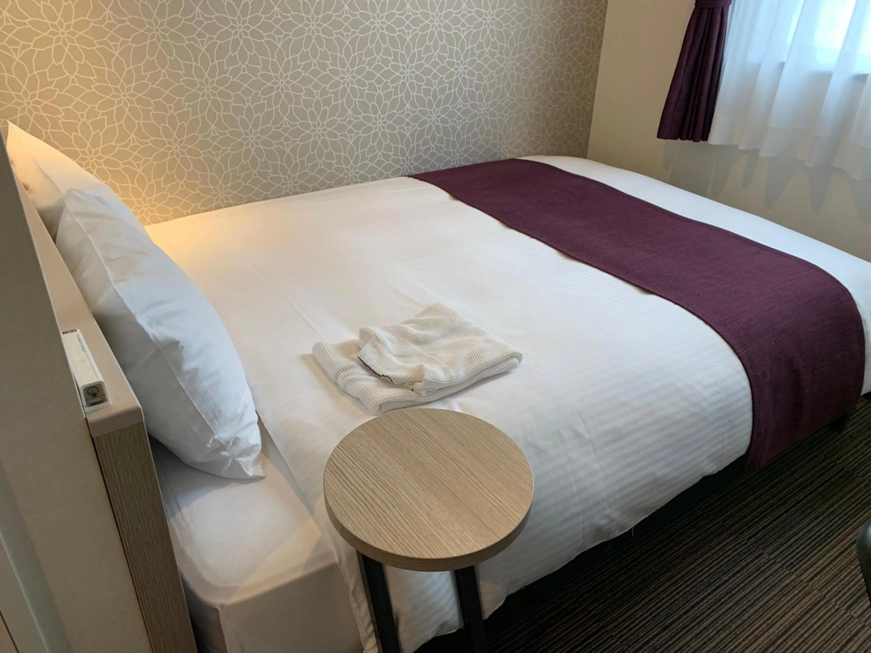 Bed in Kuretake Inn Osaka Sakaisuji Honmachi