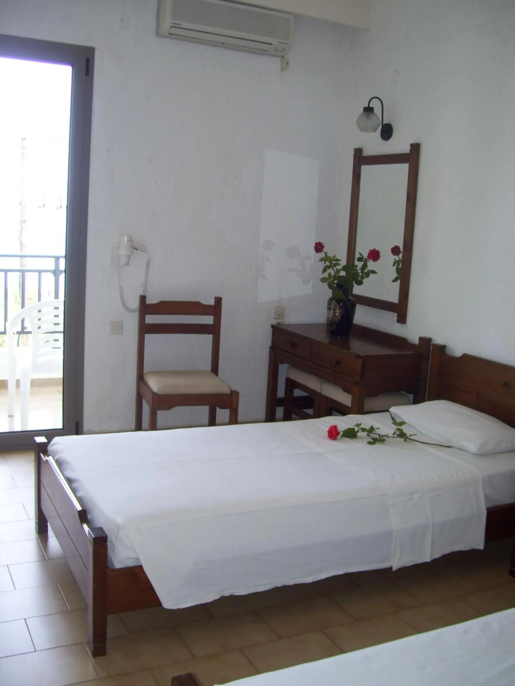 Bed in Dimitra Hotel