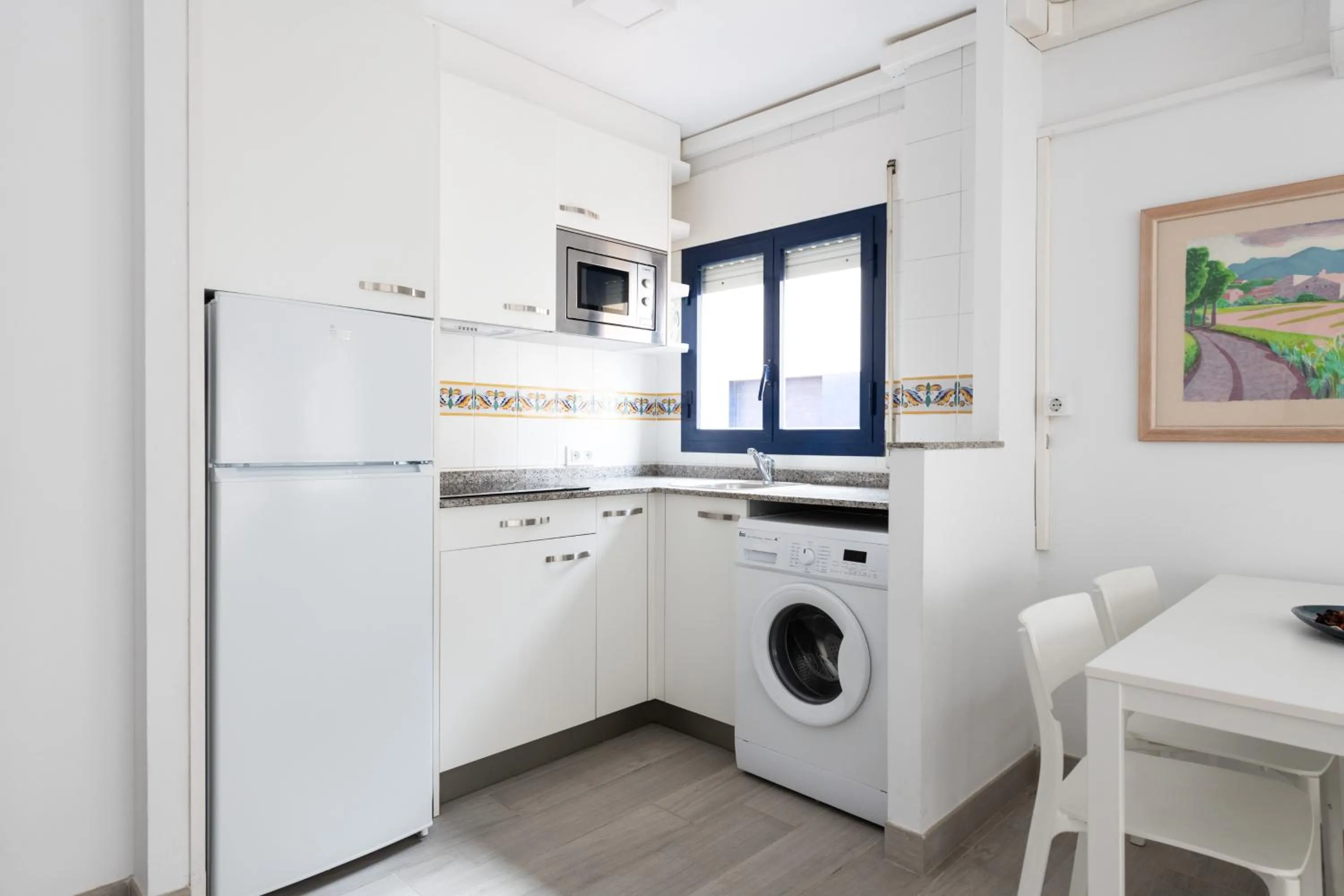 Kitchen or kitchenette in Apartamentos Marblau