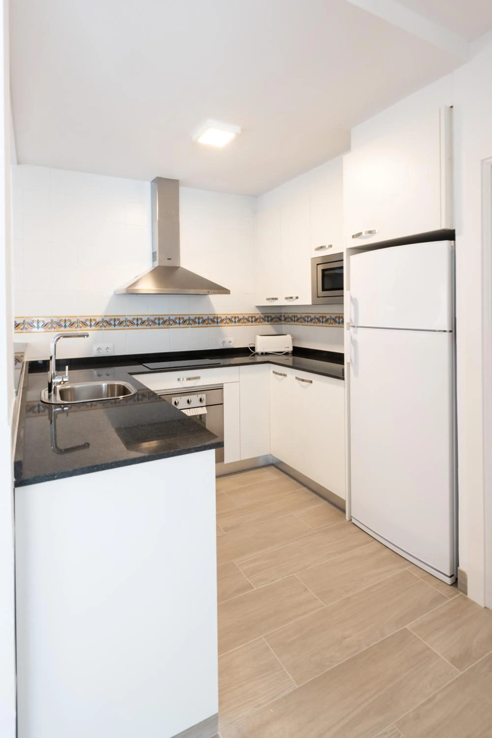 Kitchen or kitchenette in Apartamentos Marblau