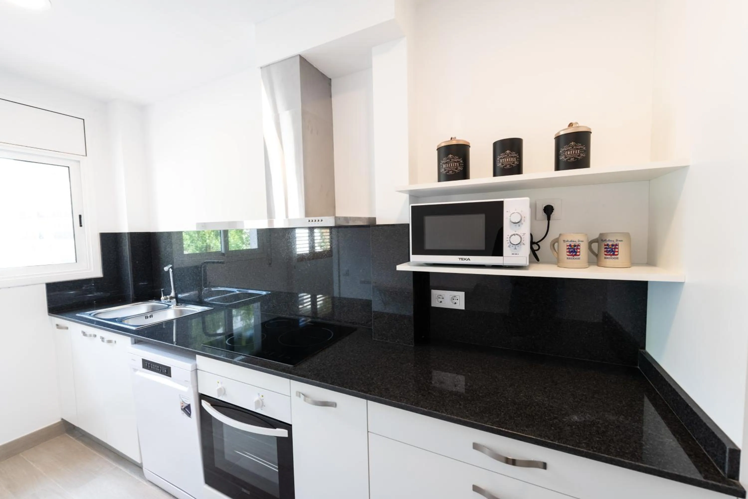 Kitchen or kitchenette in Apartamentos Marblau