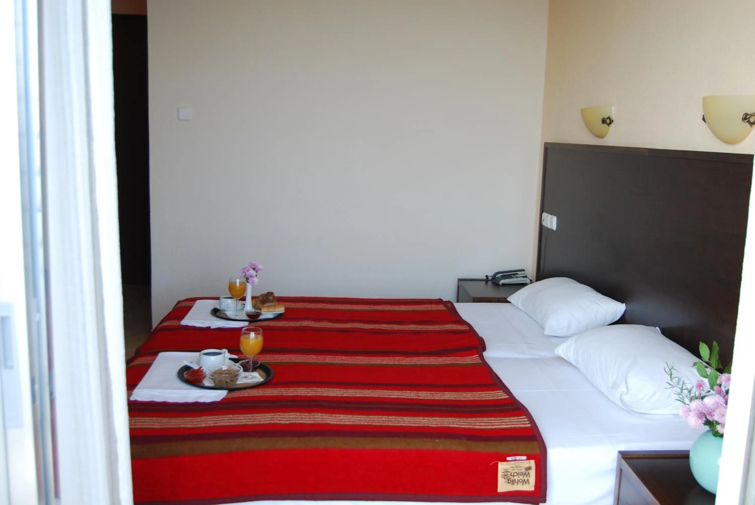 Bed in Hotel Achillion