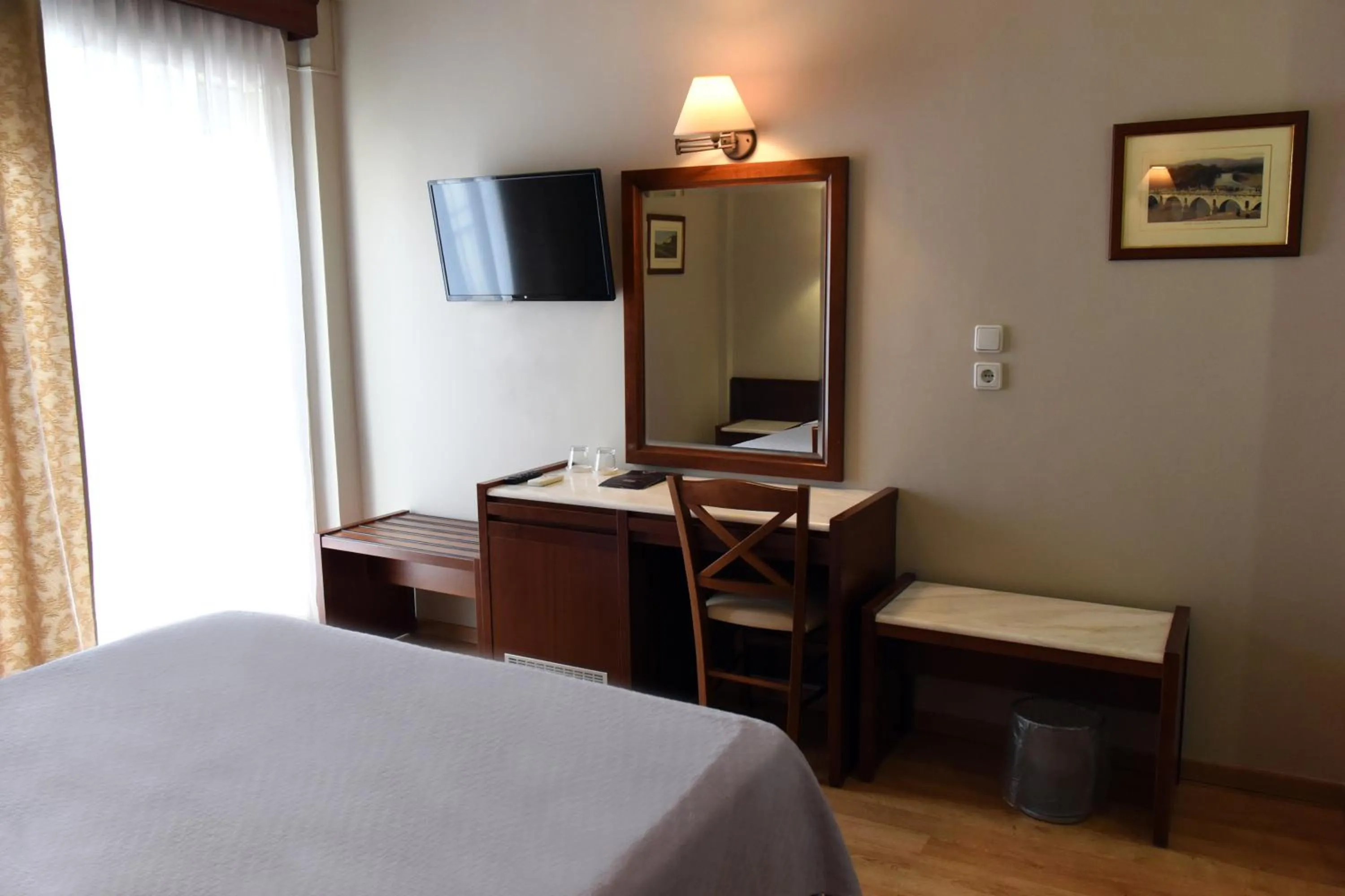 Bed in Hotel Achillion