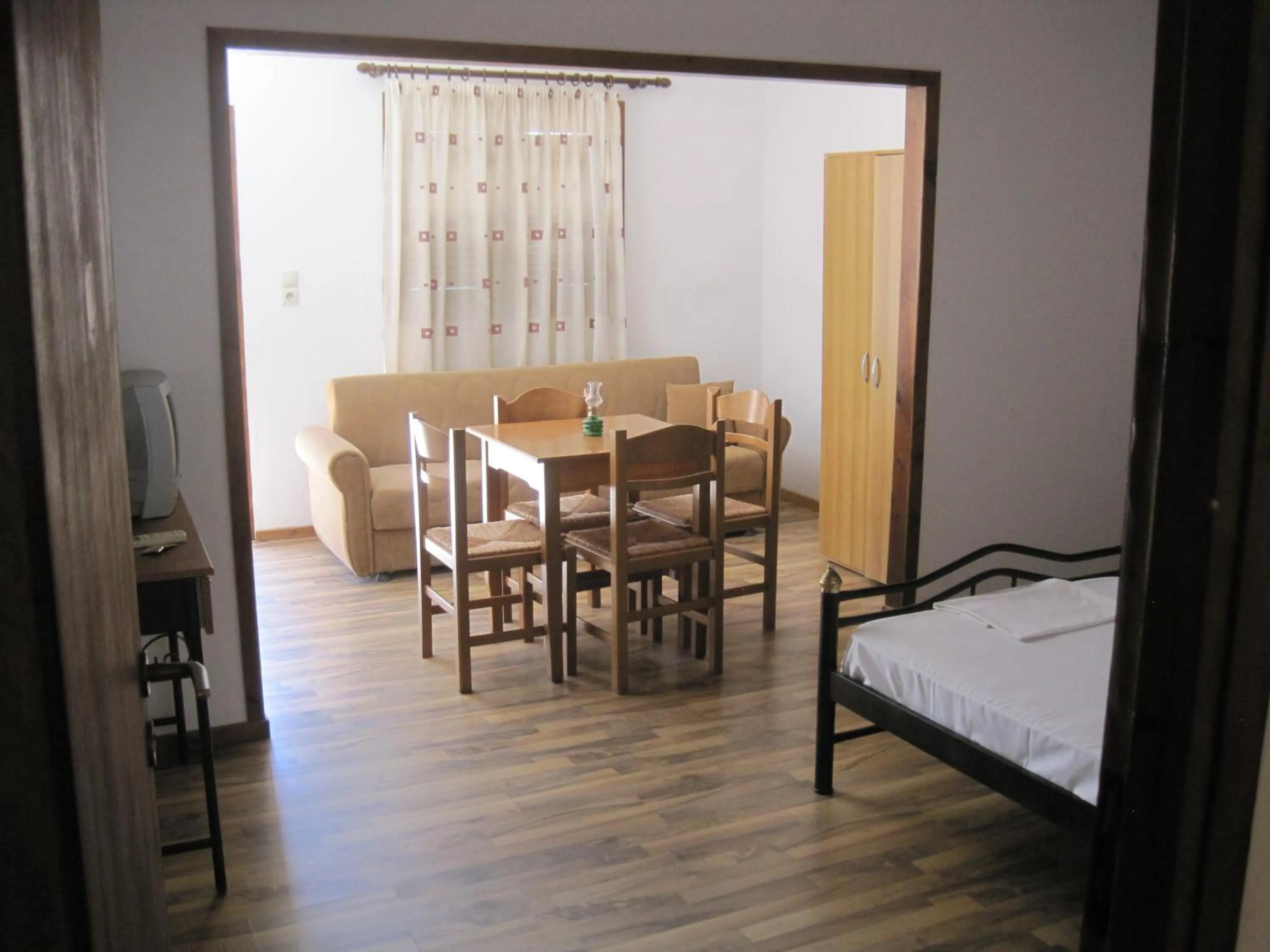Dining area, Bed in Sfinias Apartments