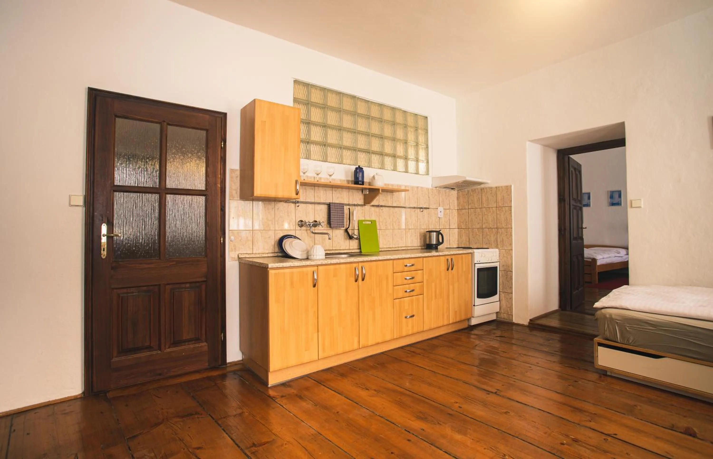 Kitchen or kitchenette, Bed in Downtown Apartments