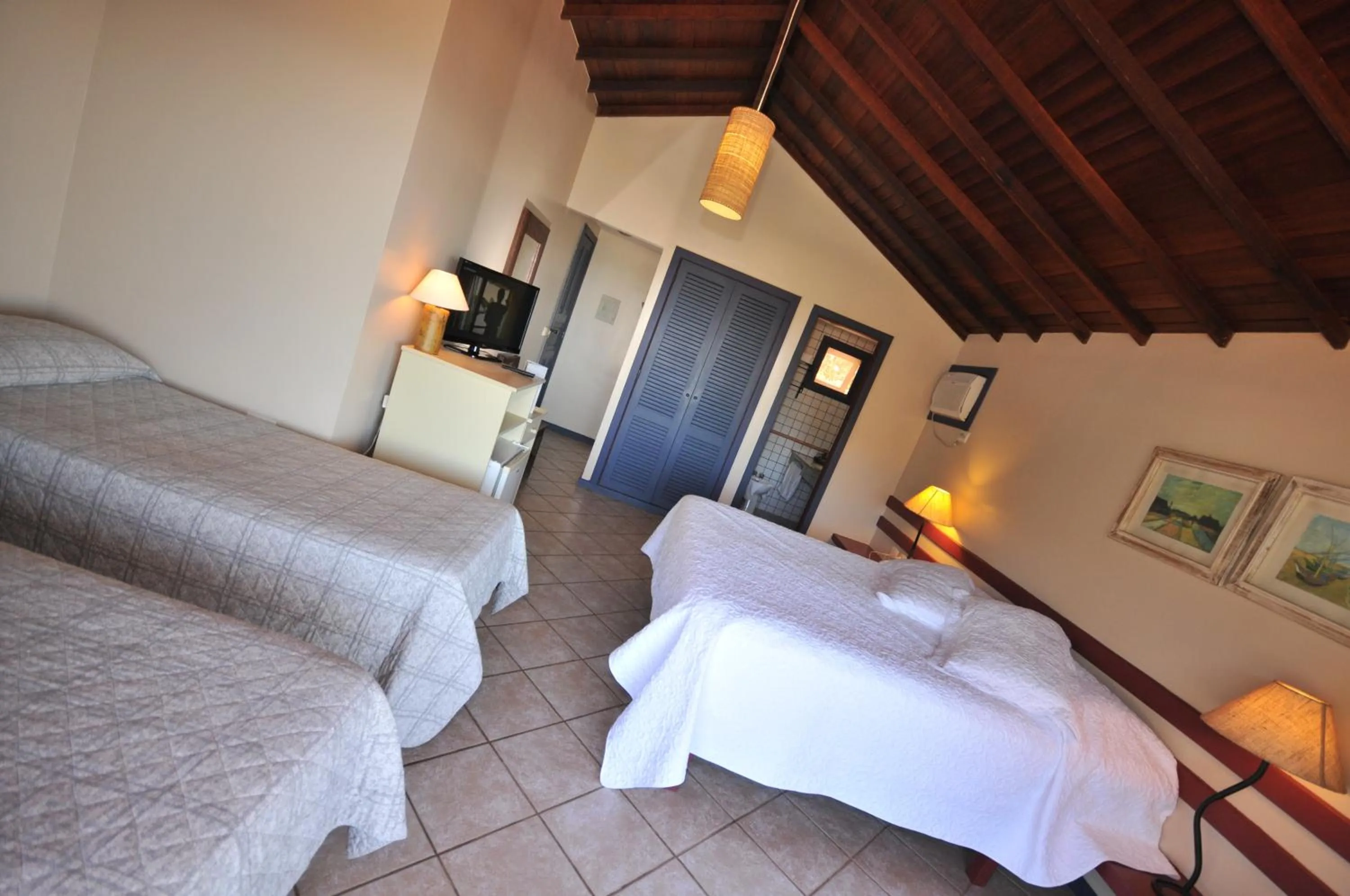 Bed in Aguabúzios Hotel