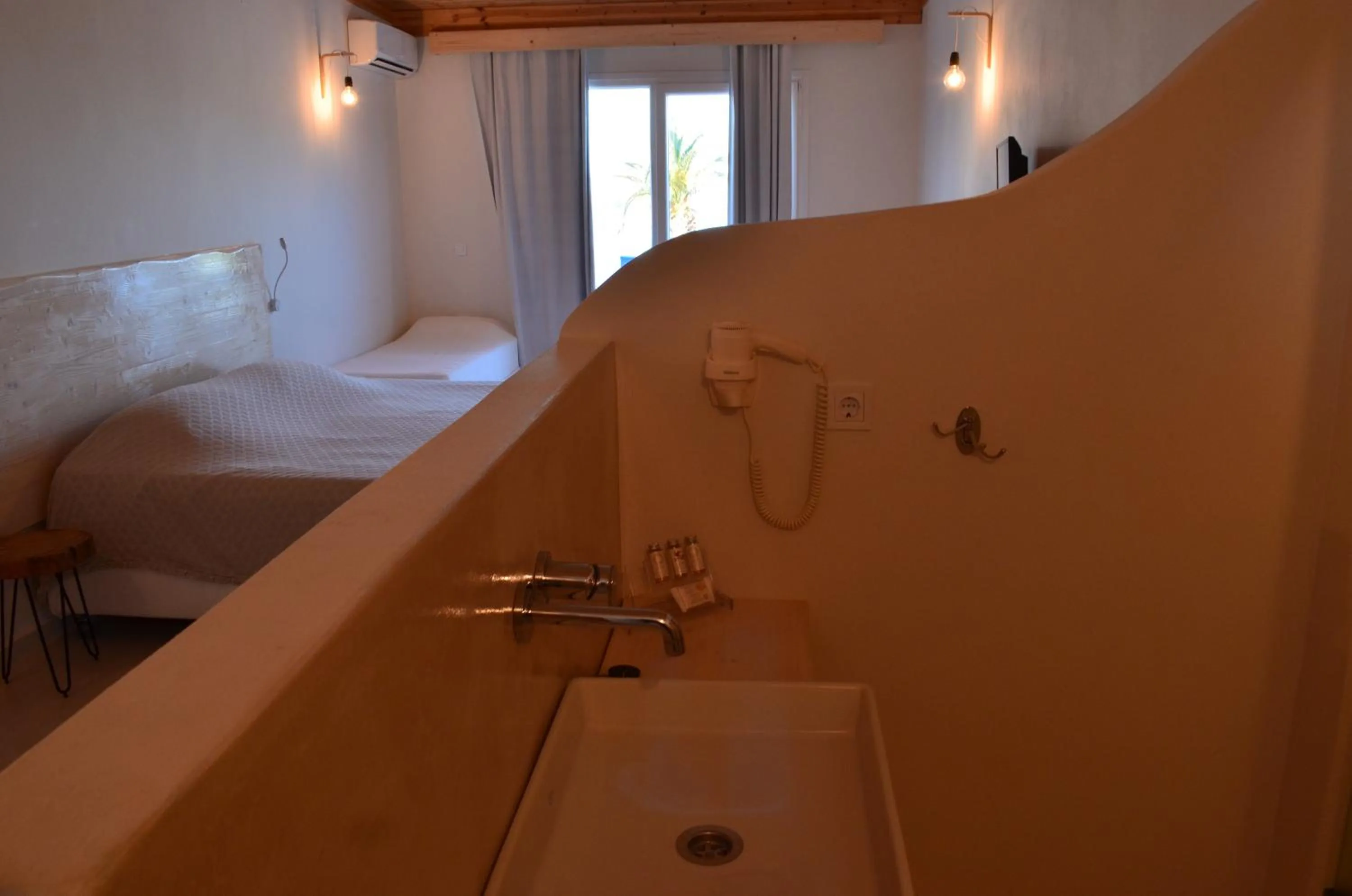 Bathroom, Bed in Faros Resort