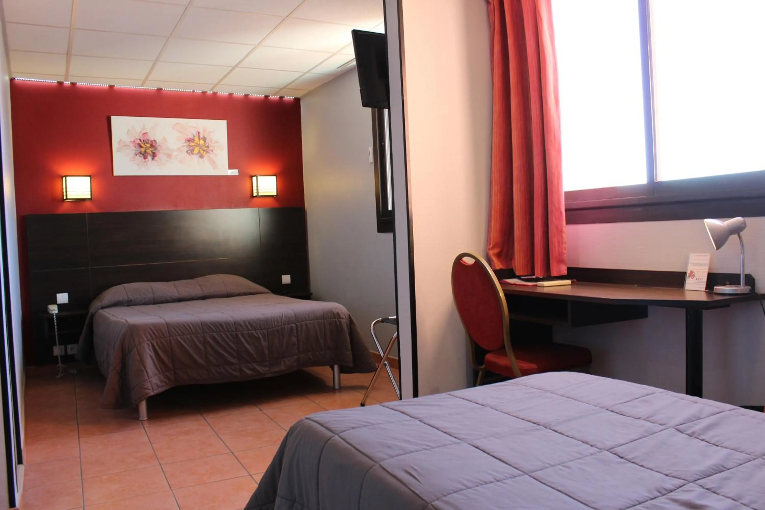 Bed in Hôtel L'Hacienda